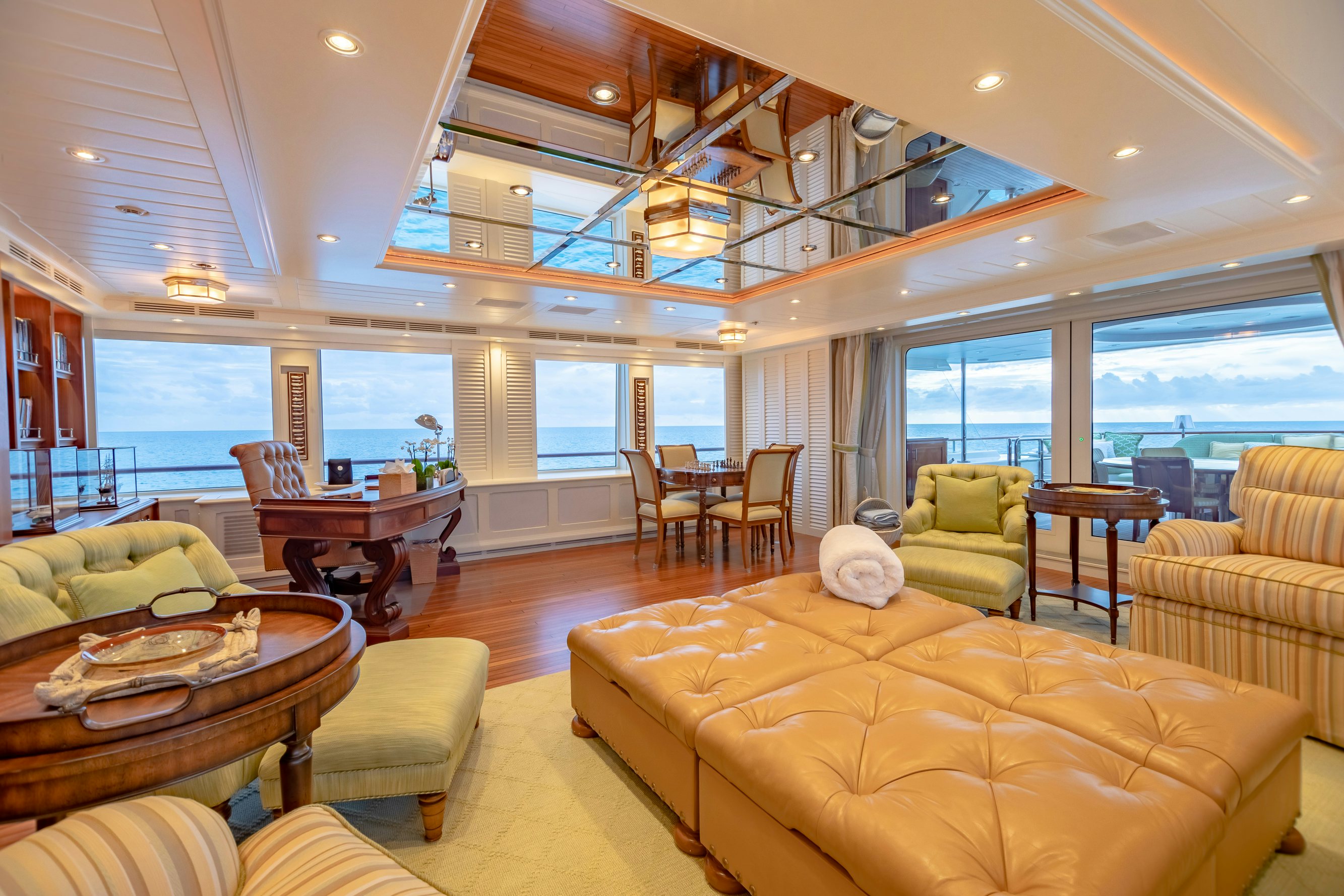 a living room with a large window aboard SHADOWL Yacht for Charter