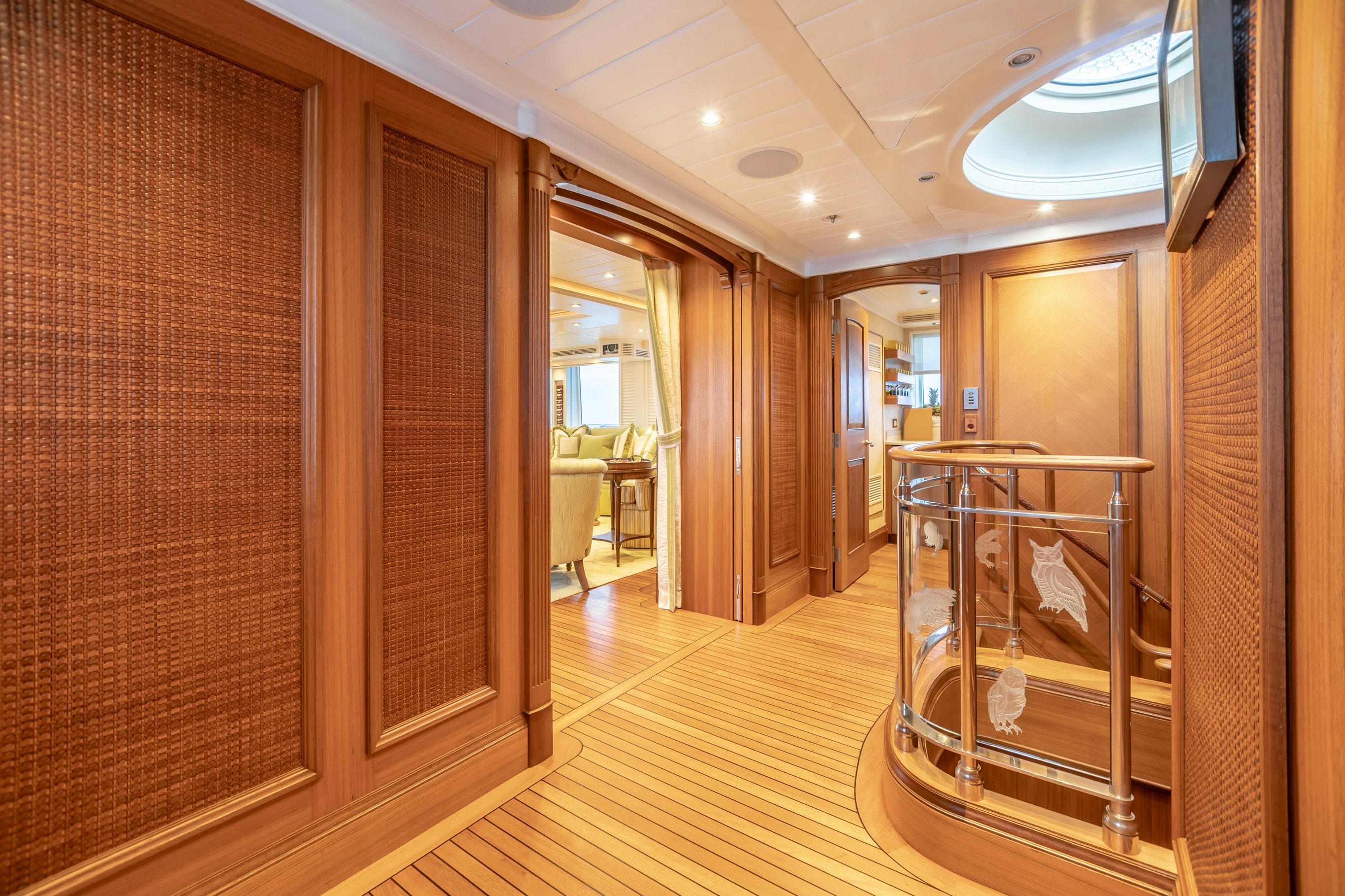 a room with a wood floor and a wood floor and a mirror aboard SHADOWL Yacht for Sale