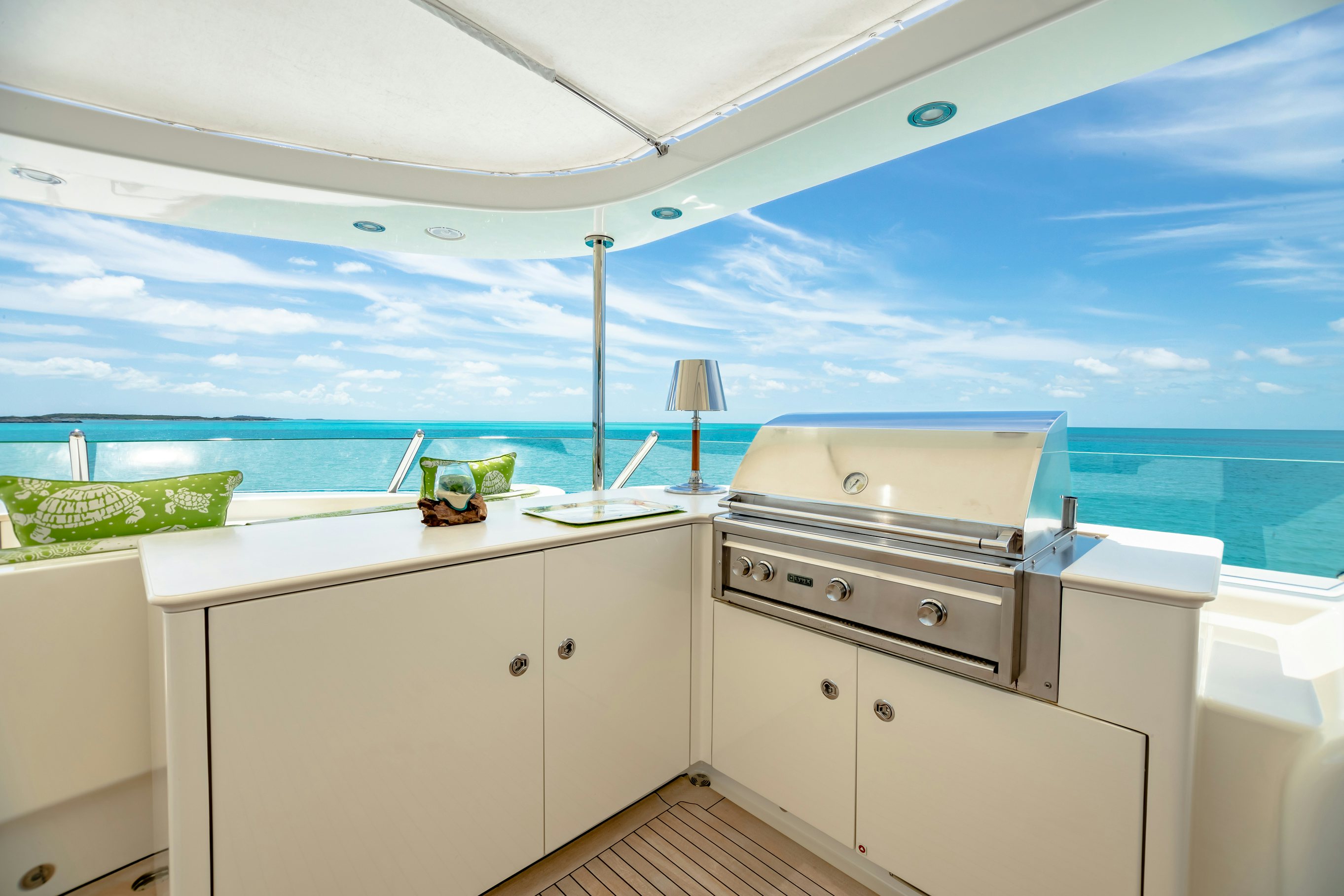 a white kitchen with a large window aboard SHADOWL Yacht for Charter