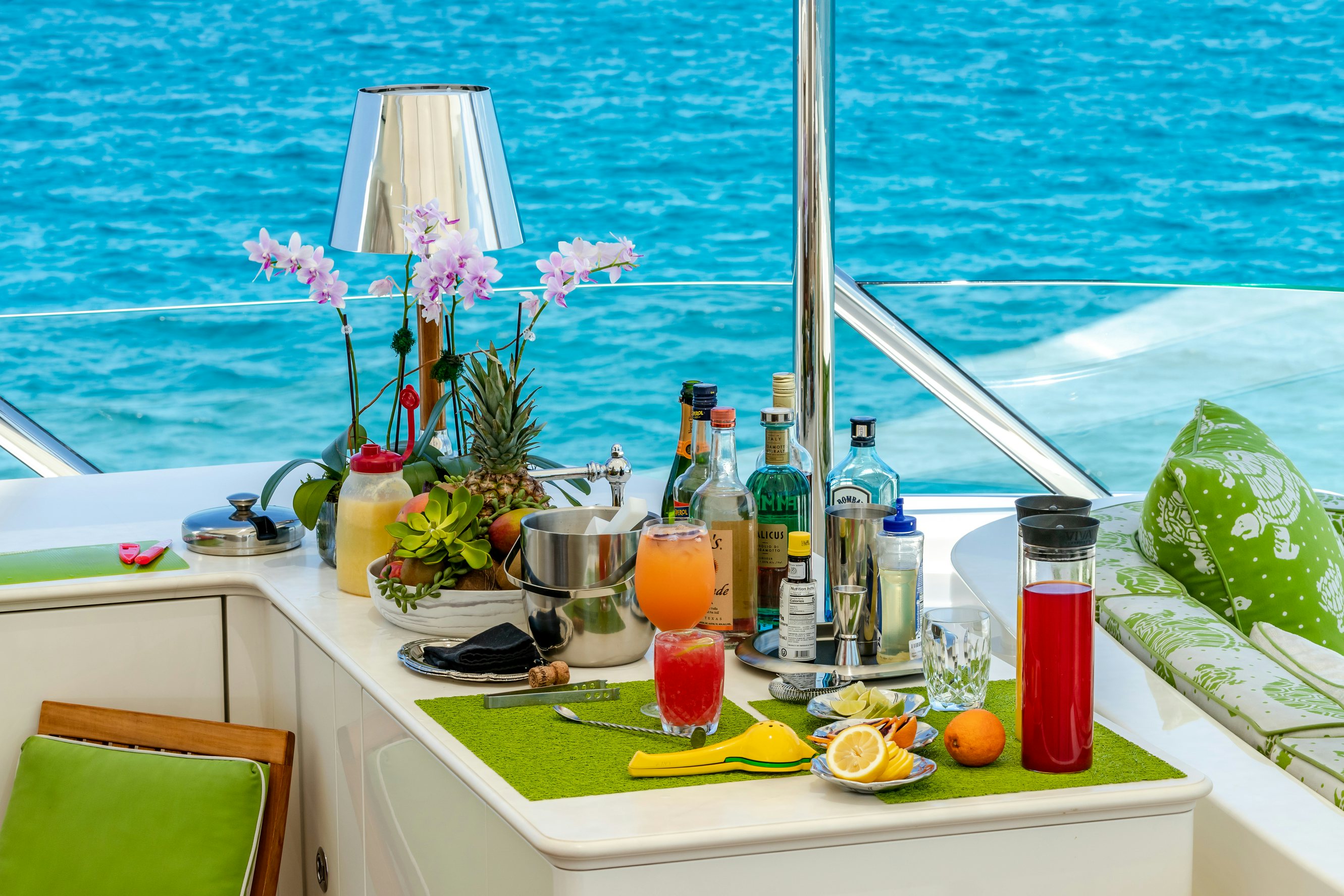 a table with drinks and fruits on it aboard SHADOWL Yacht for Charter