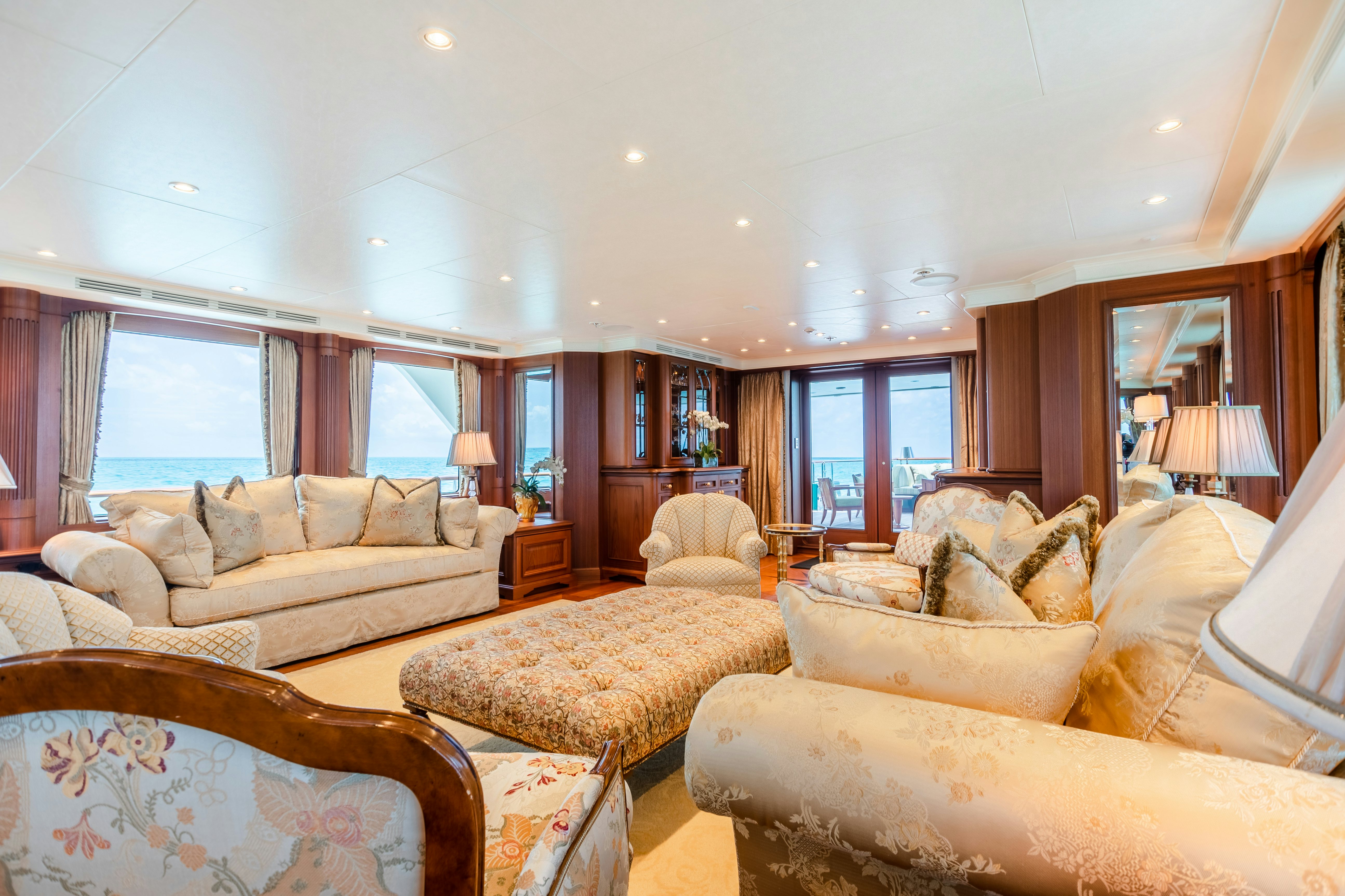 a living room with a couch and a table aboard SHADOWL Yacht for Sale