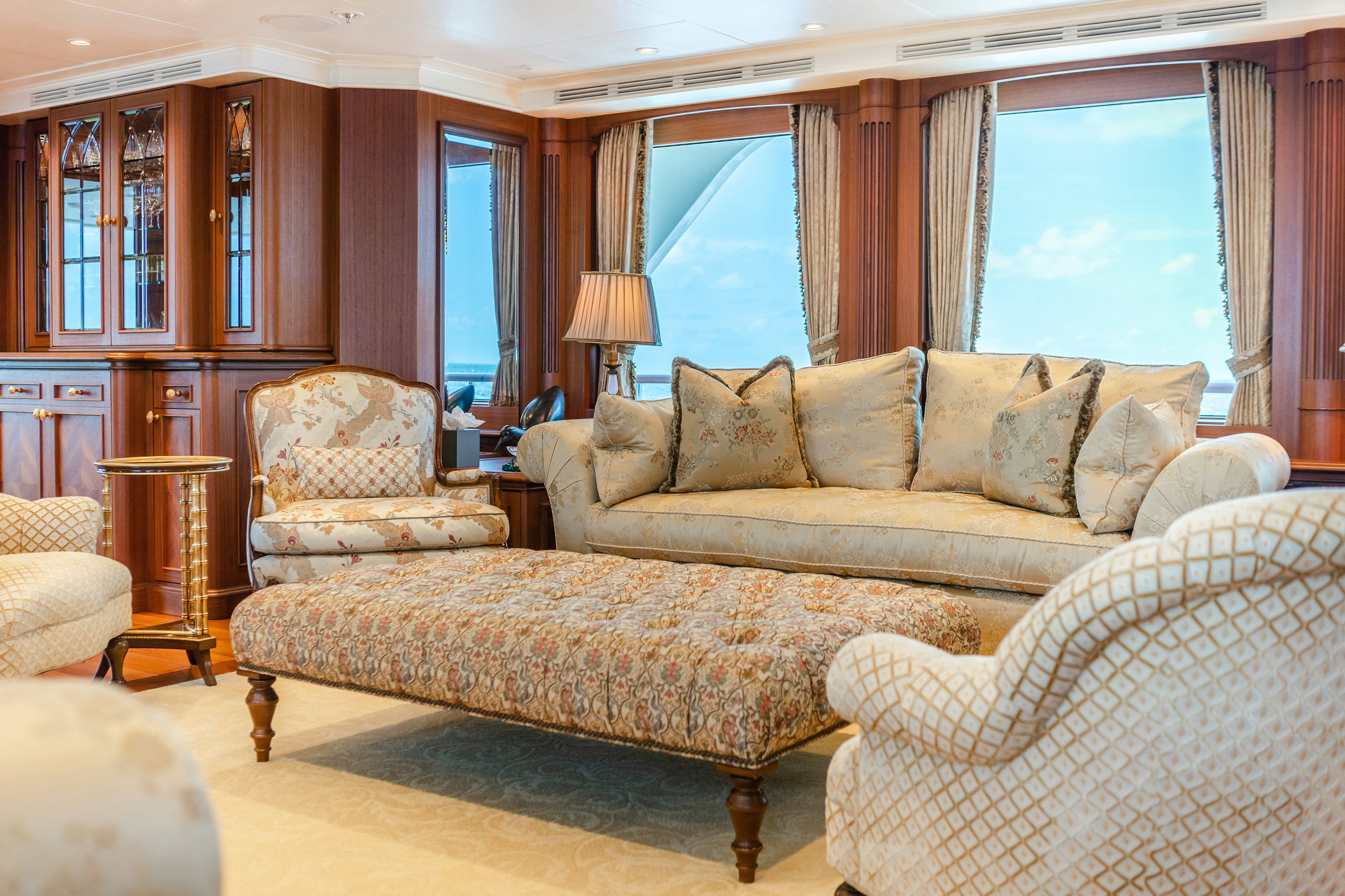 a living room with a large window aboard SHADOWL Yacht for Sale
