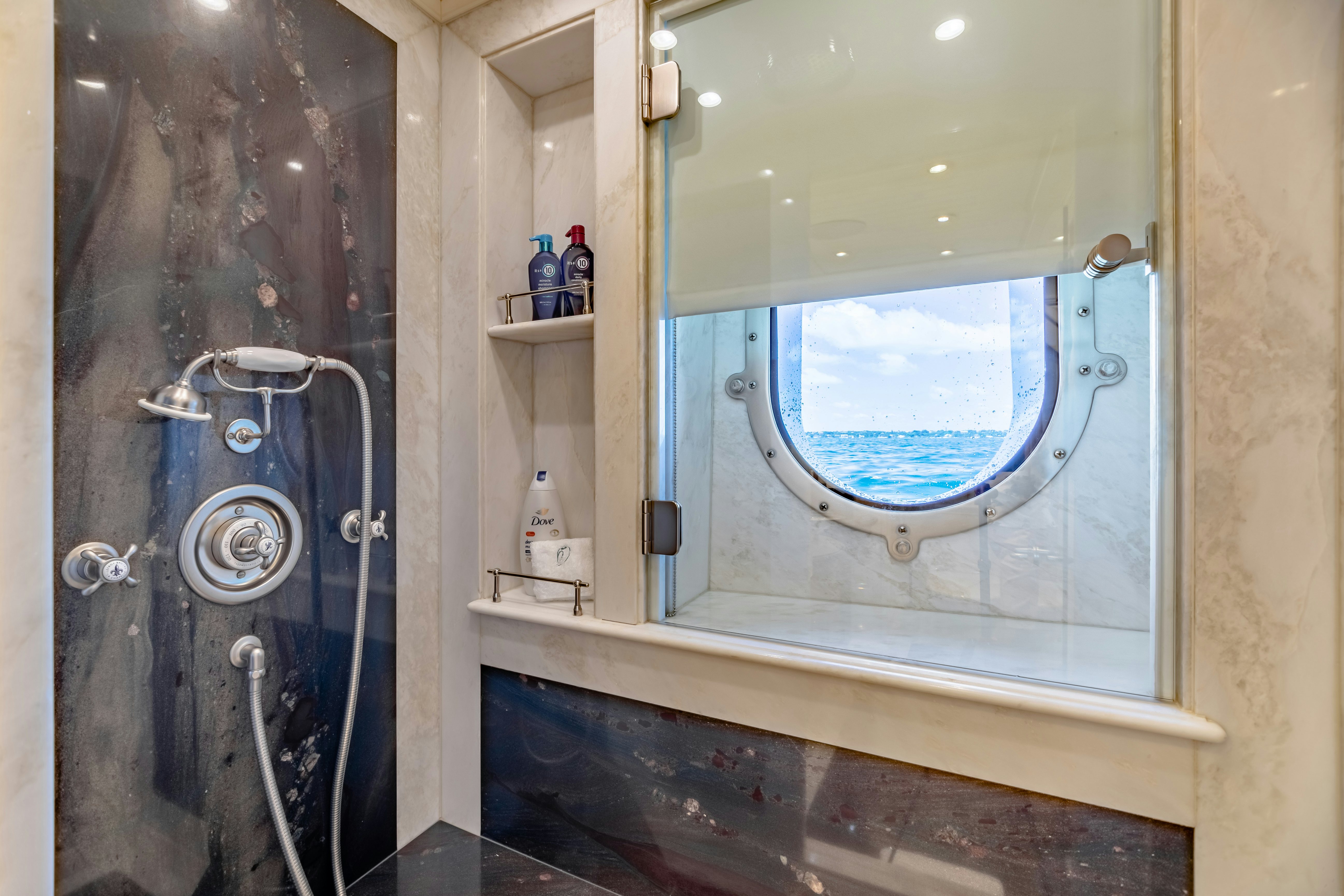 a bathroom with a large window aboard SHADOWL Yacht for Sale