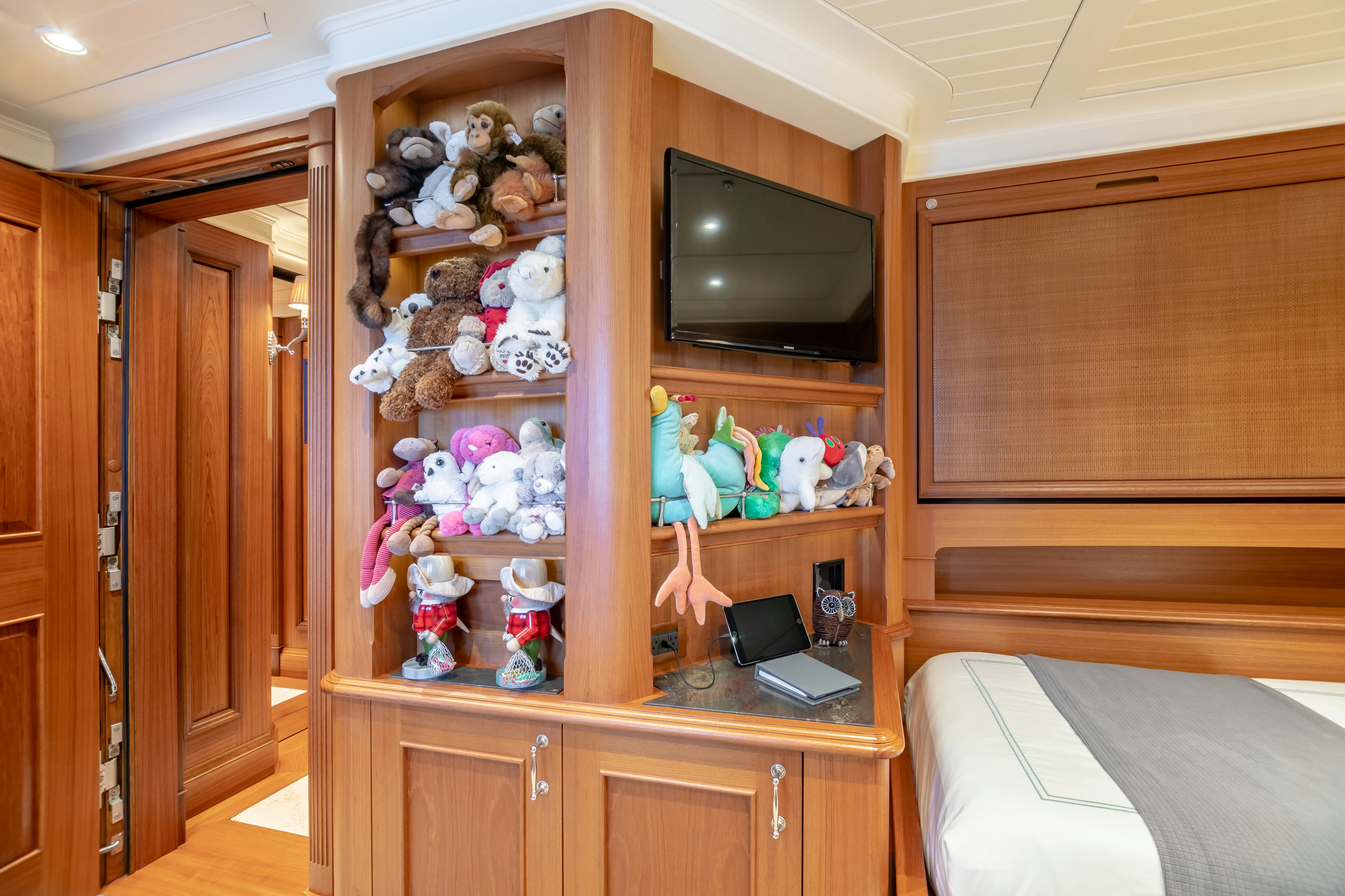 a shelf with stuffed animals aboard SHADOWL Yacht for Sale