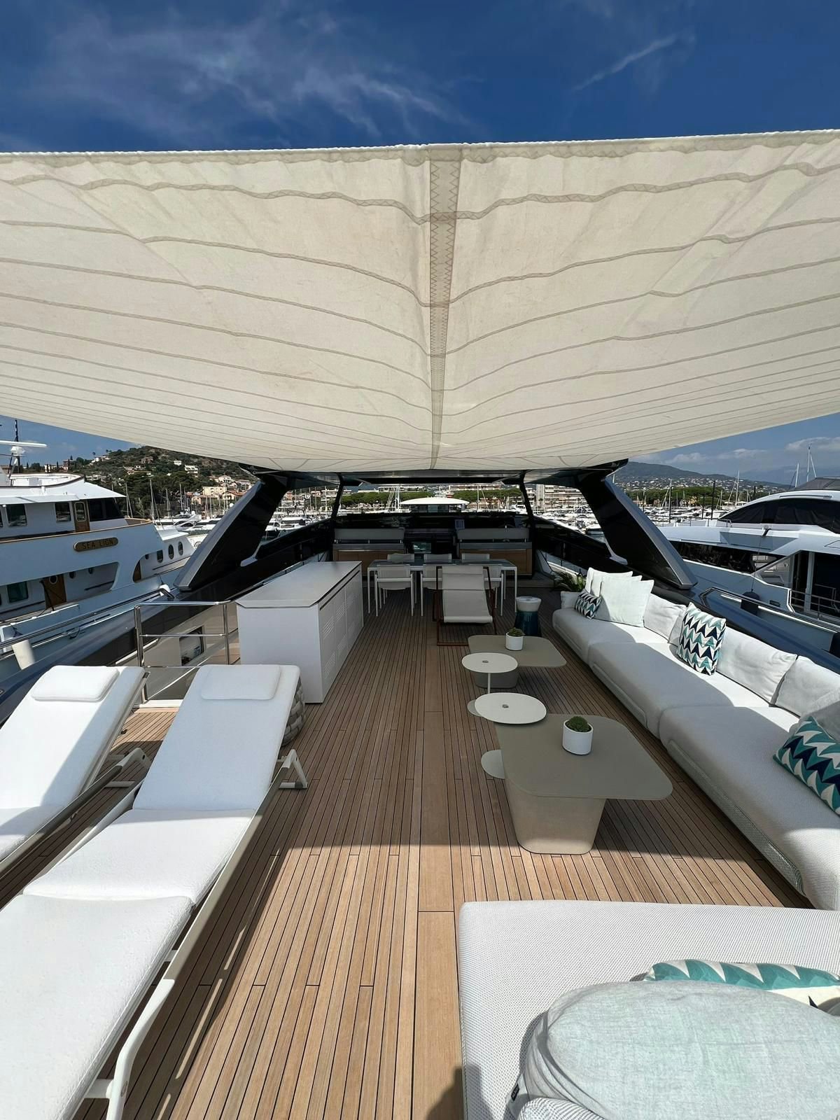a deck with a deck and a view of the water aboard MAREA Yacht for Sale
