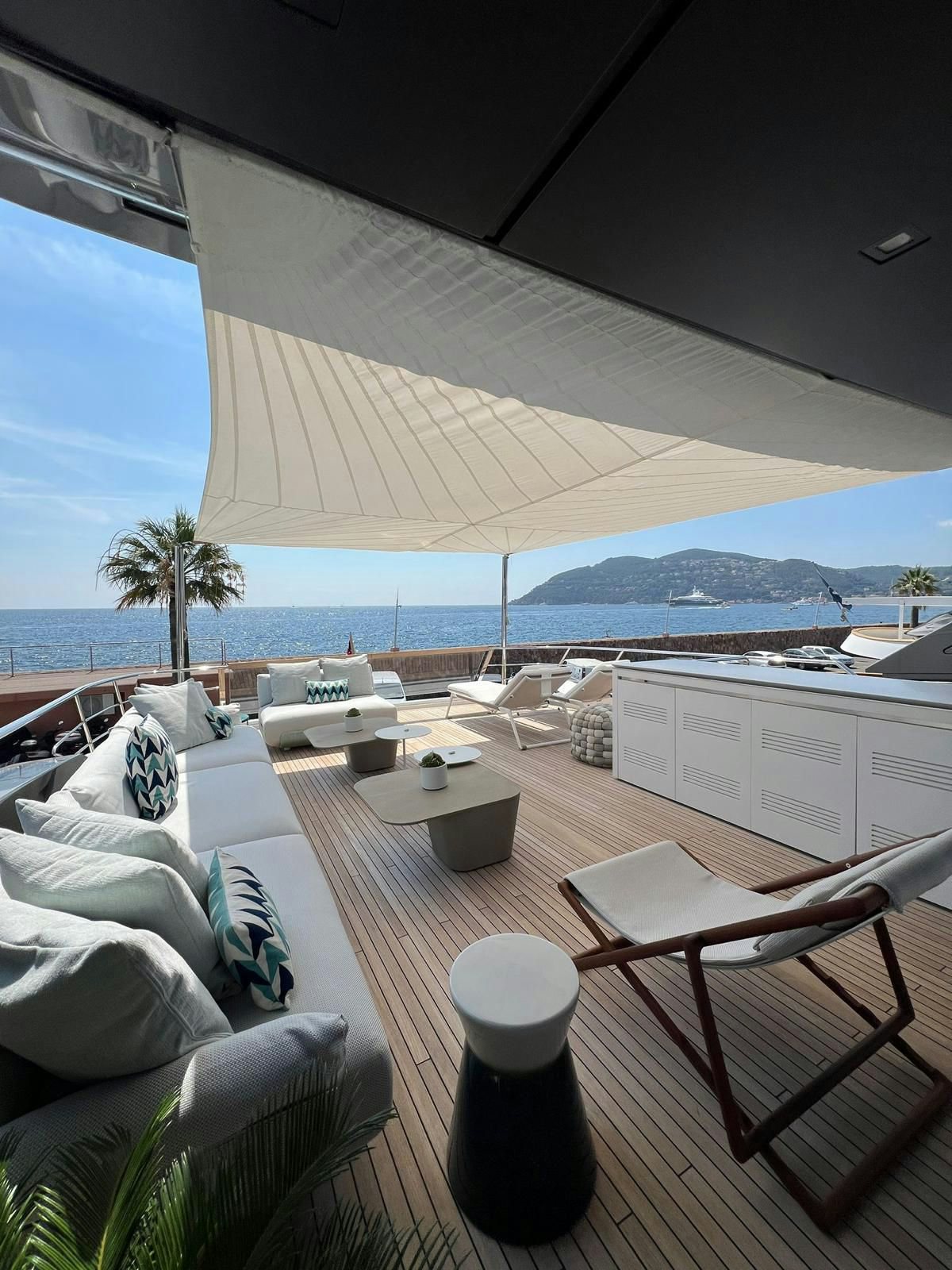 a patio with a table and chairs aboard MAREA Yacht for Sale