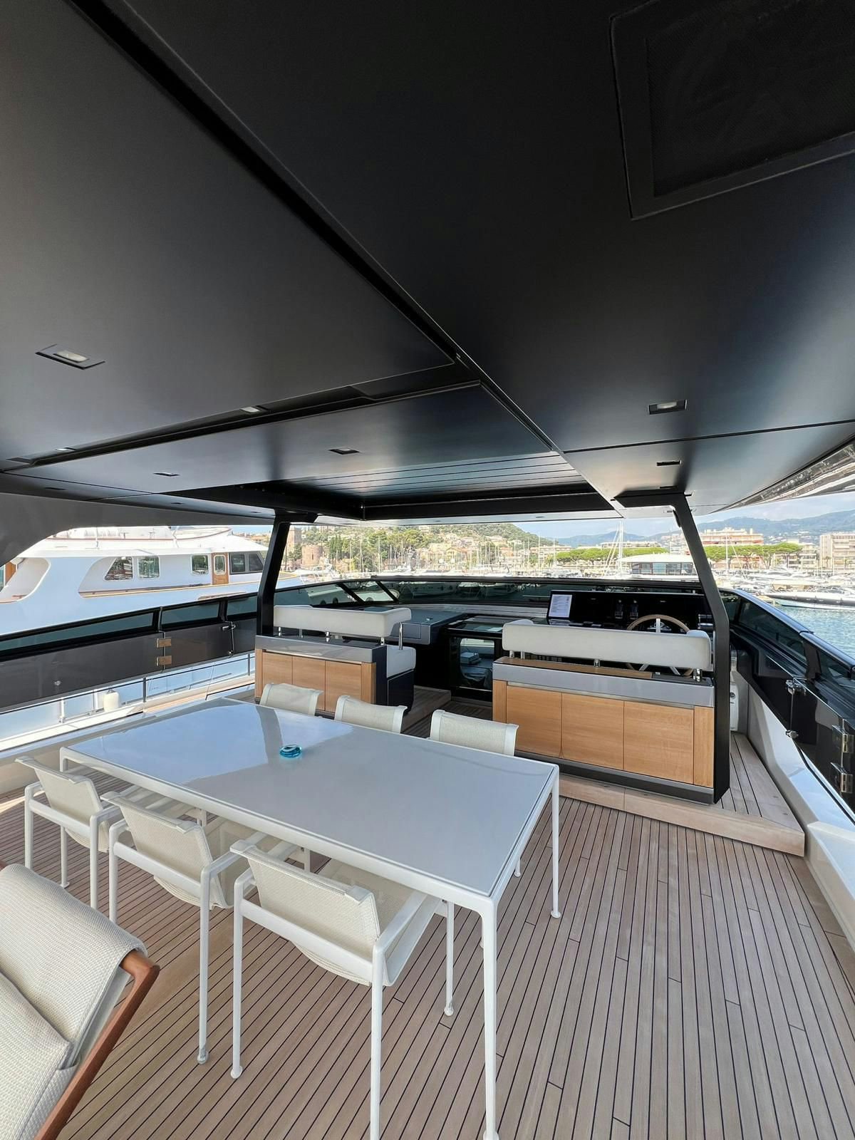 a table and chairs on a deck aboard MAREA Yacht for Sale