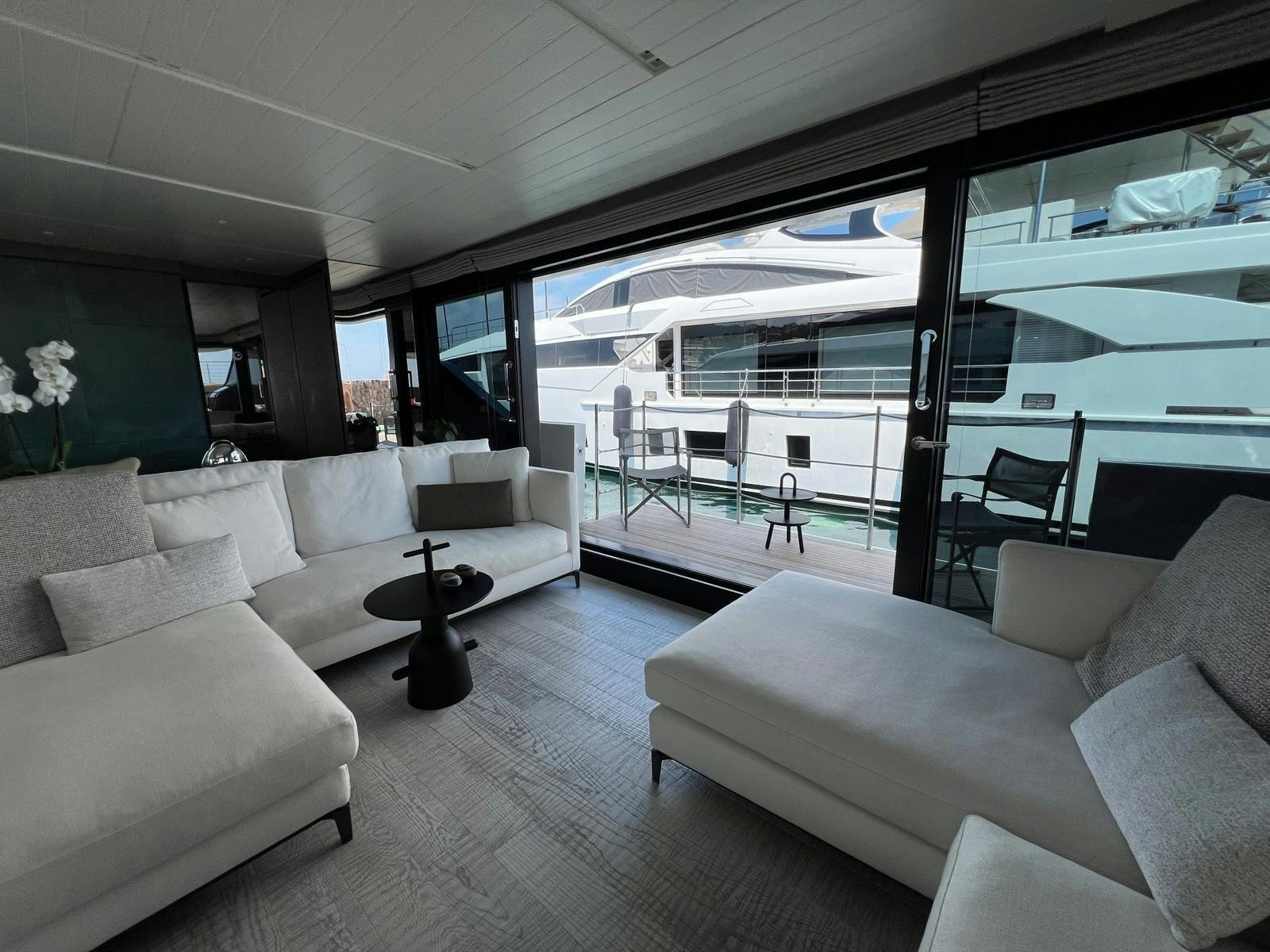 a living room with a large glass window aboard MAREA Yacht for Sale