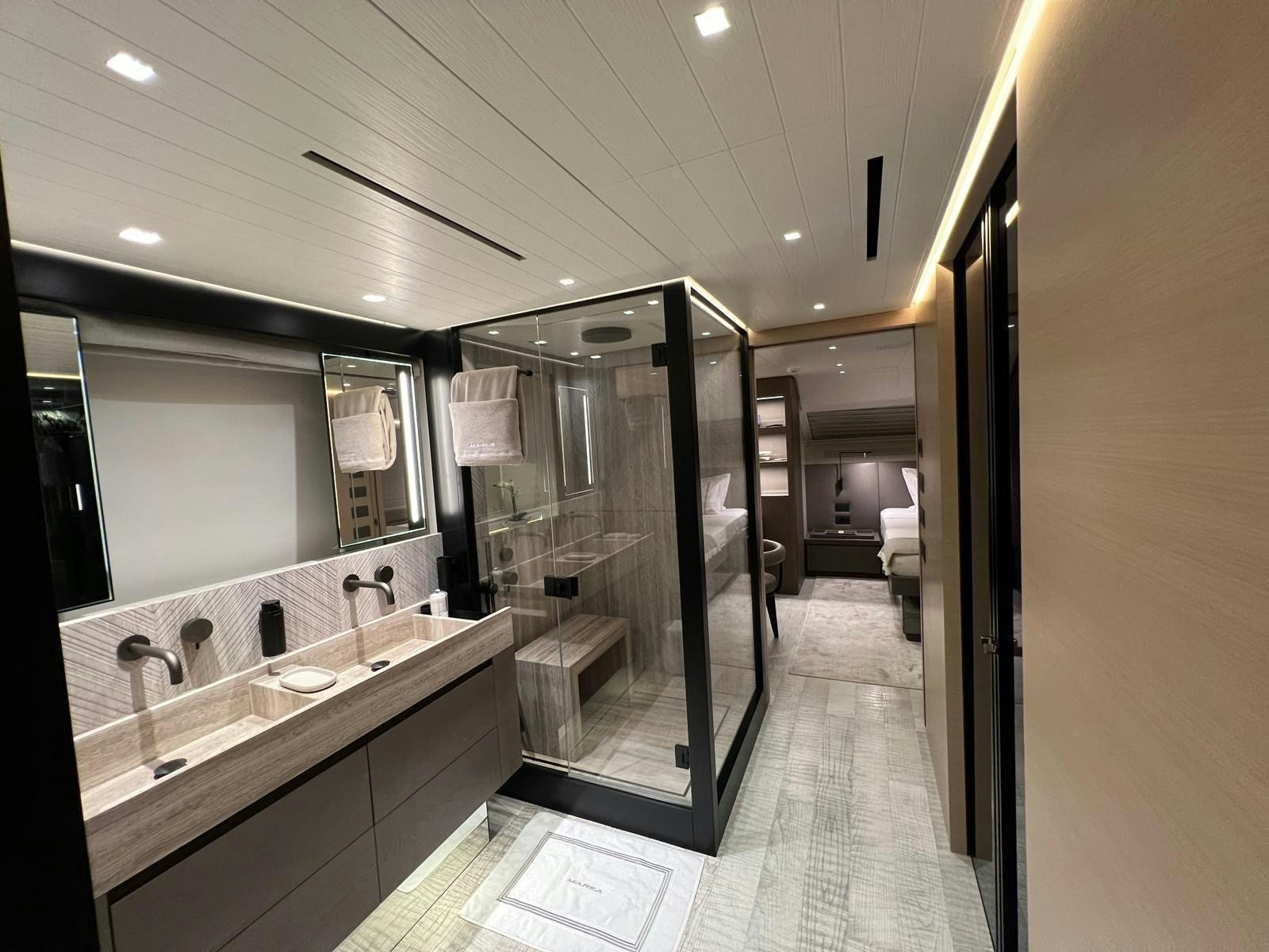a bathroom with a large mirror aboard MAREA Yacht for Sale