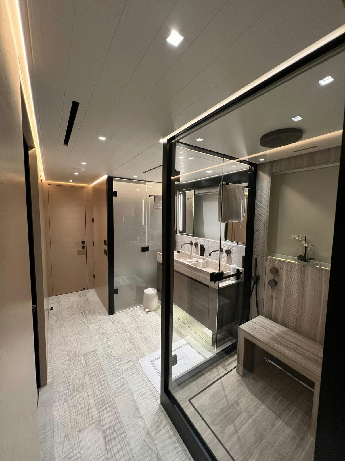 a bathroom with a large mirror aboard MAREA Yacht for Sale