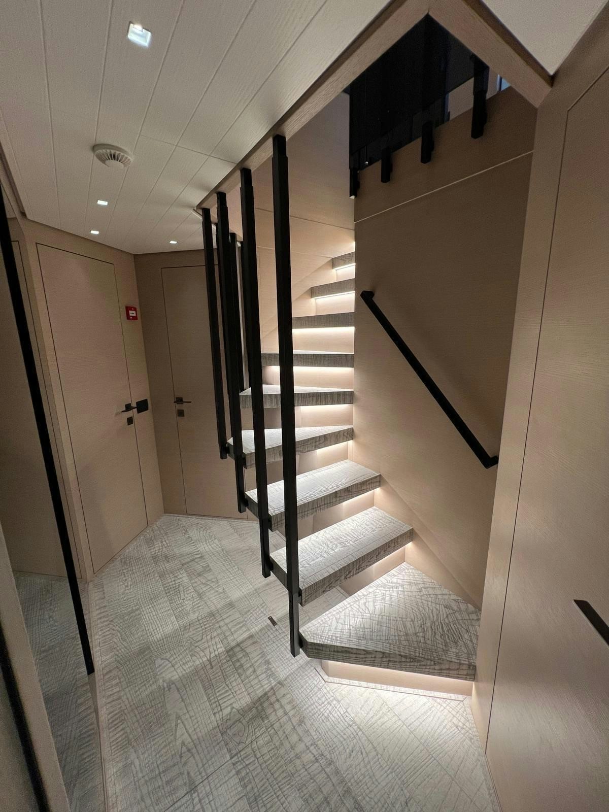 a long hallway with a set of stairs aboard MAREA Yacht for Sale