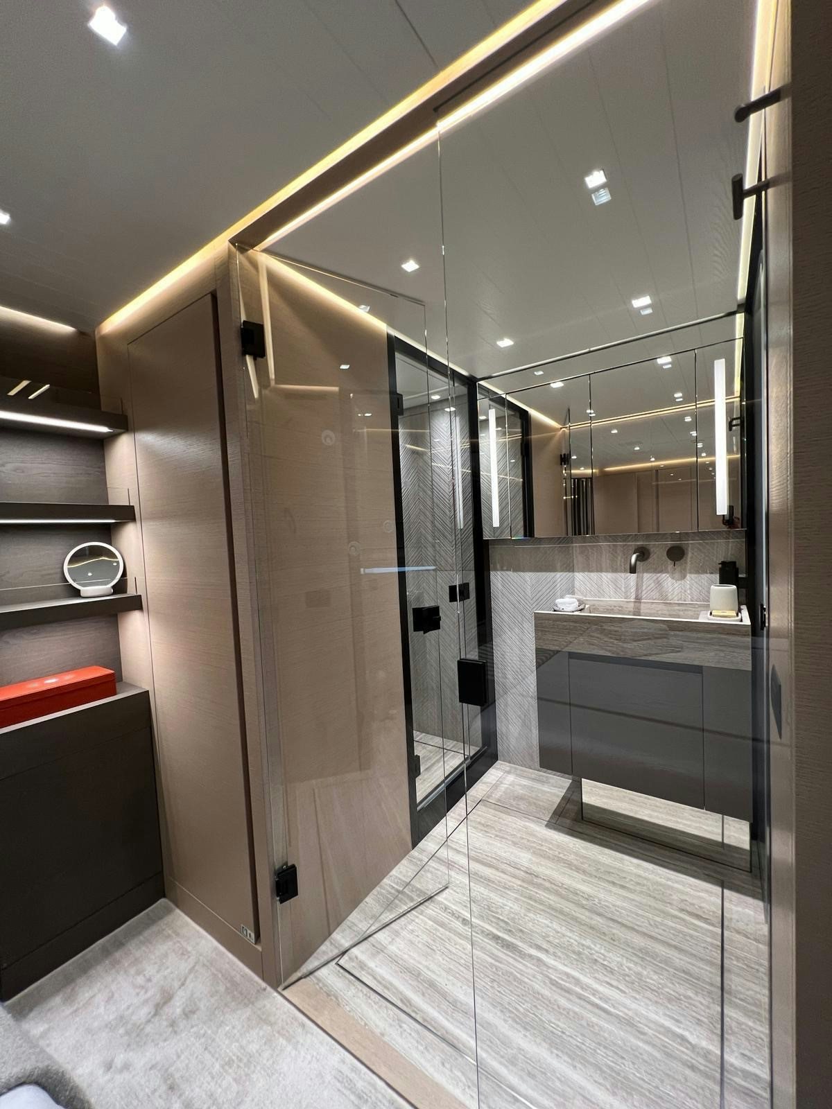 a bathroom with a glass shower aboard MAREA Yacht for Sale