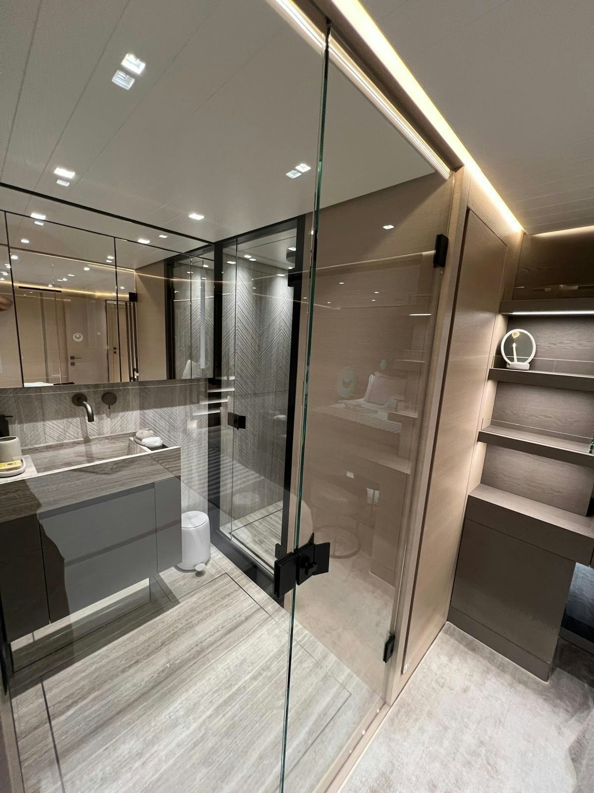 a bathroom with a glass shower aboard MAREA Yacht for Sale