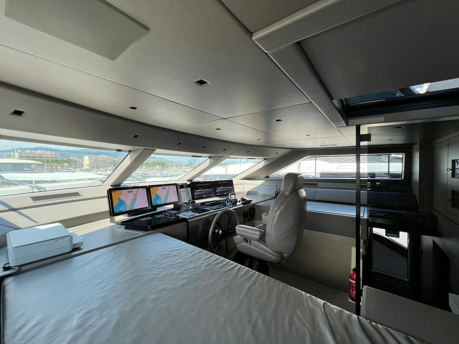 inside of a vehicle with a view of the water and the land below aboard MAREA Yacht for Sale