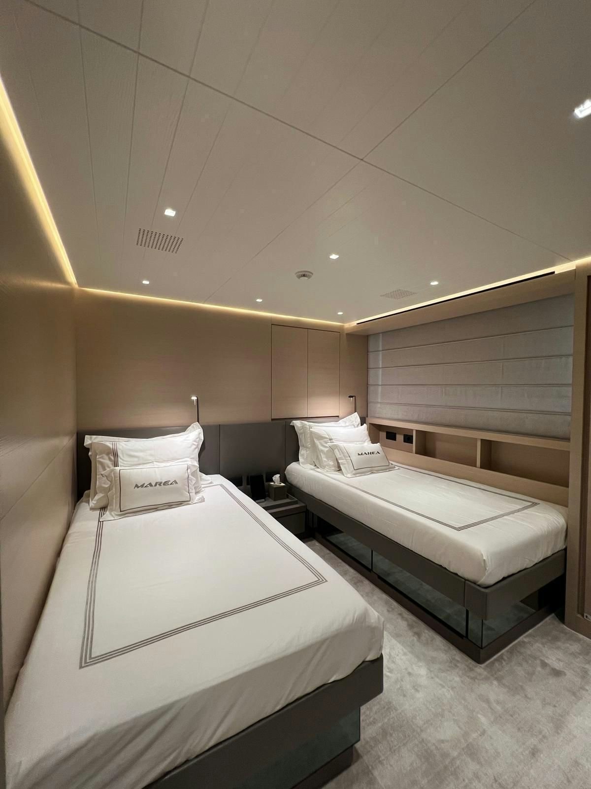 a couple of beds in a room aboard MAREA Yacht for Sale