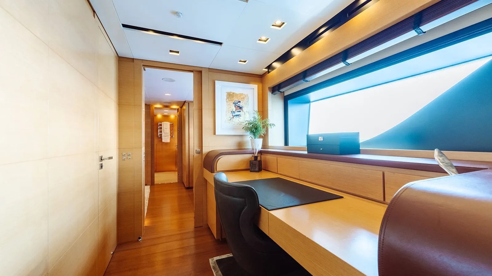 a room with a table and chairs aboard AWAY Yacht for Charter