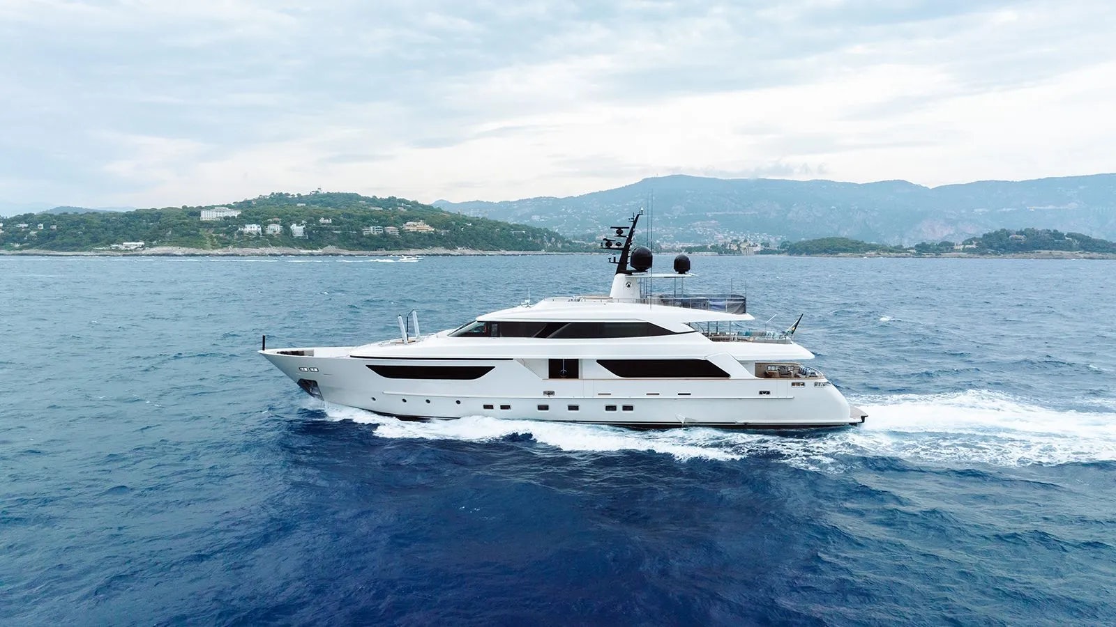 a white boat on the water aboard AWAY Yacht for Charter