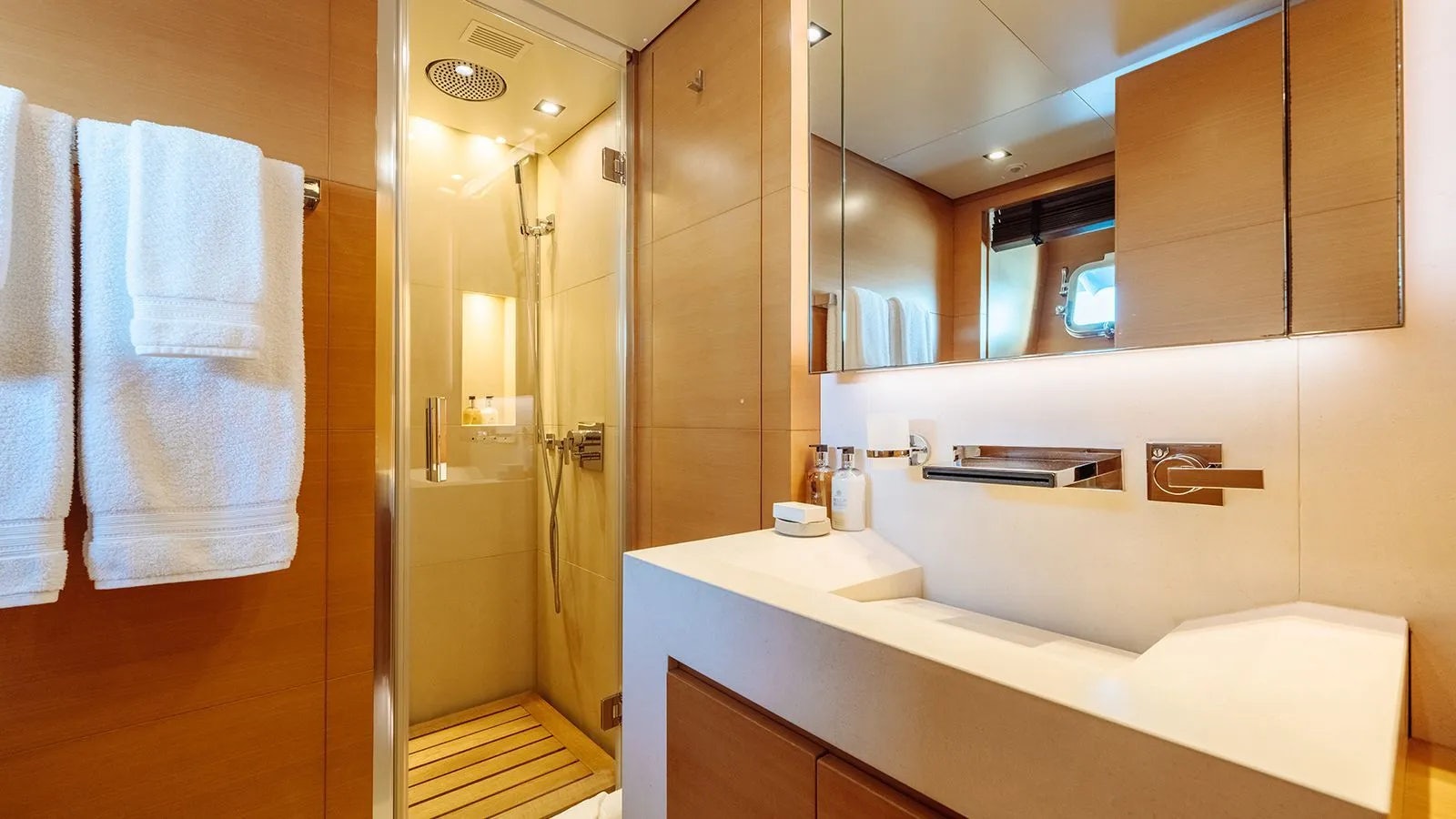 a bathroom with a sink and a mirror aboard AWAY Yacht for Charter