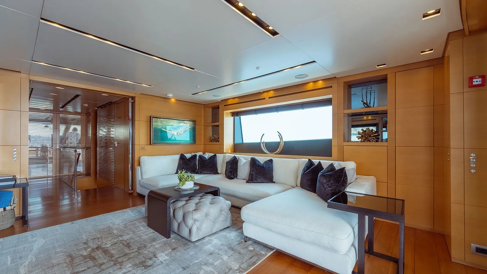 a living room with a couch and a table aboard AWAY Yacht for Charter