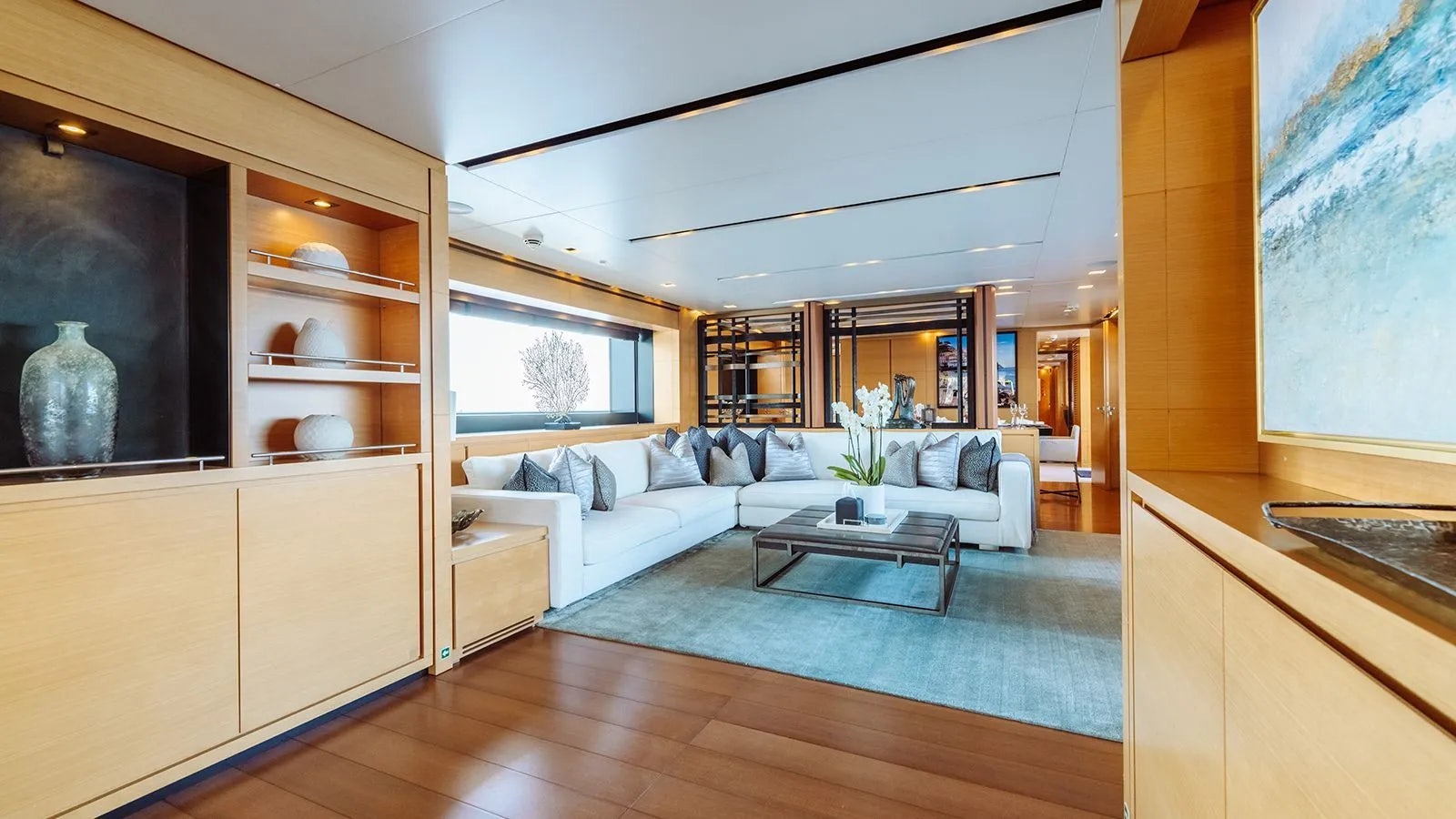 a living room with a white couch aboard AWAY Yacht for Charter