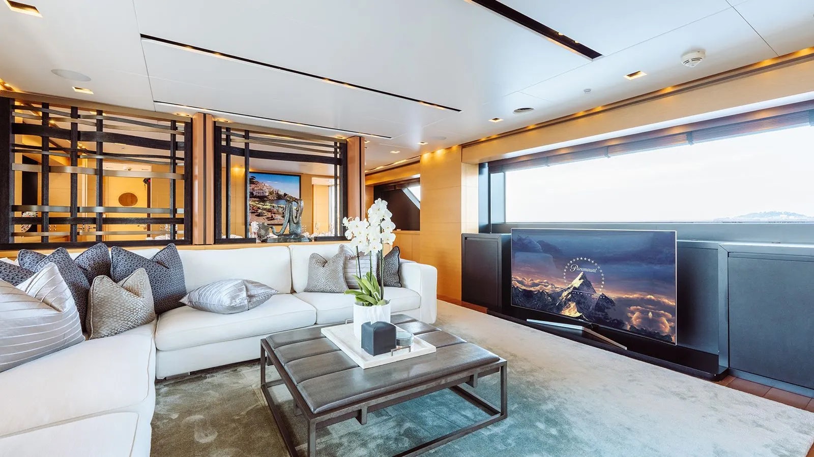 a living room with a large fireplace aboard AWAY Yacht for Charter