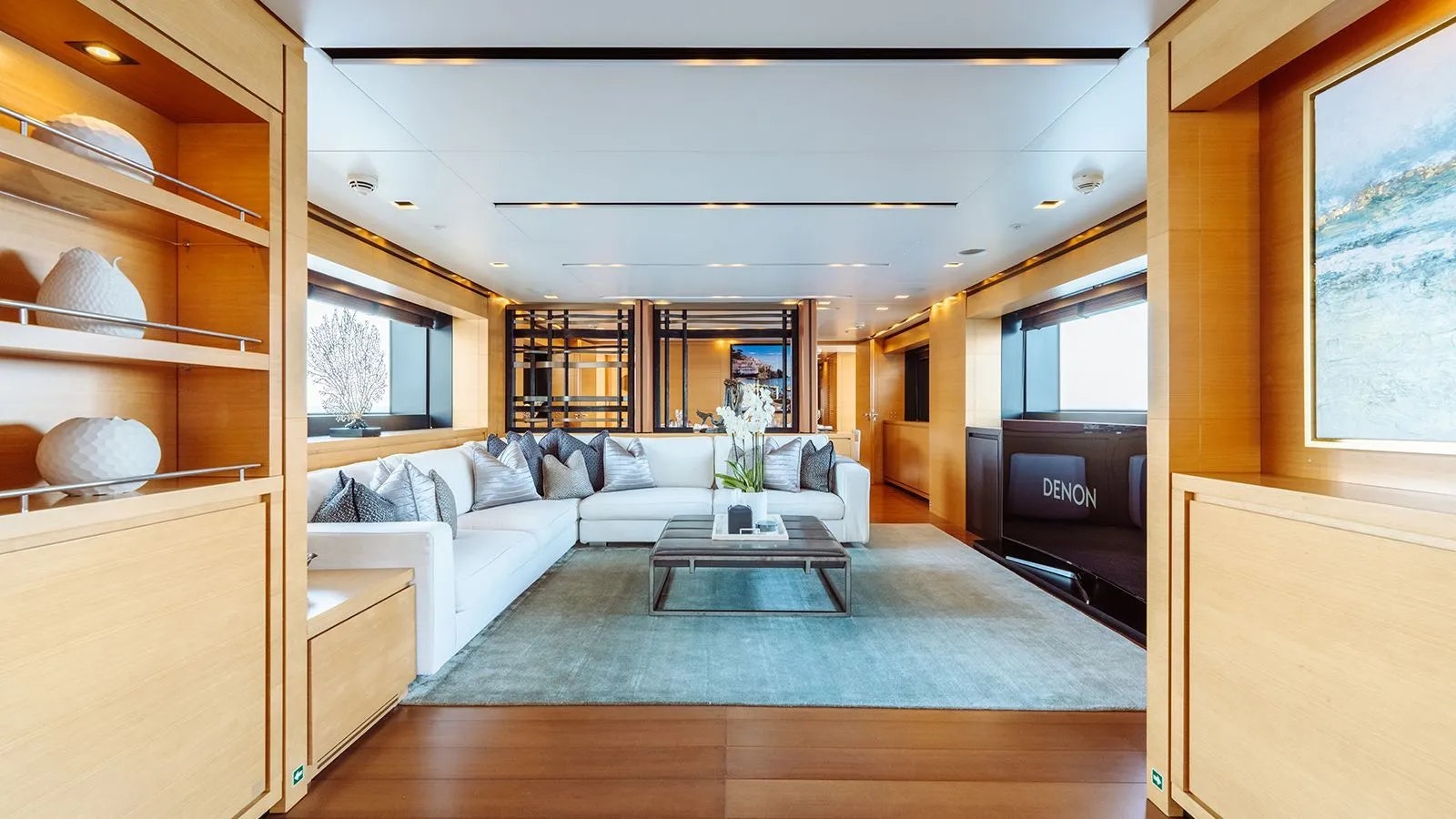 a living room with a large window aboard AWAY Yacht for Charter