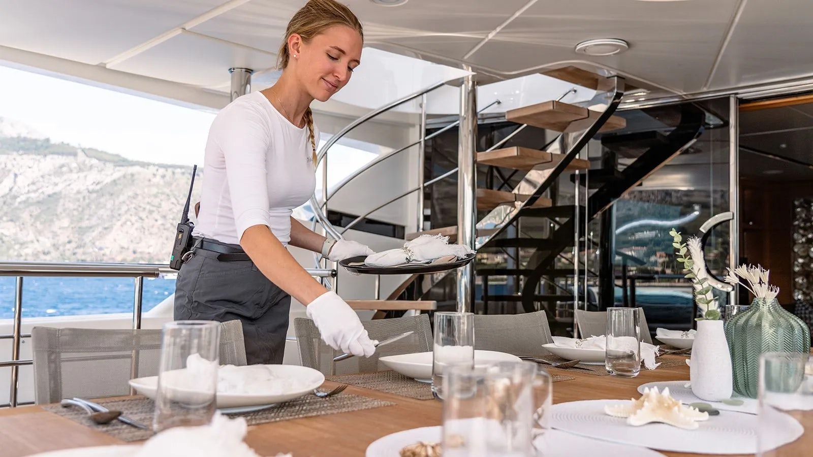 a person preparing food in a restaurant aboard AWAY Yacht for Charter