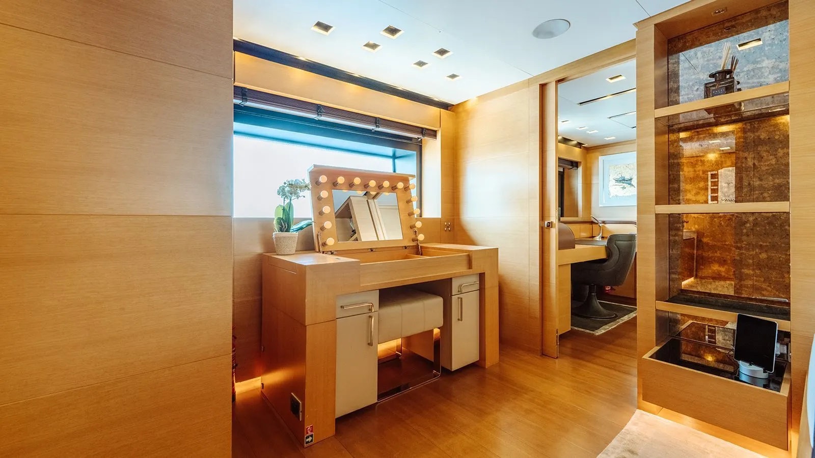 a room with a desk and a window aboard AWAY Yacht for Charter