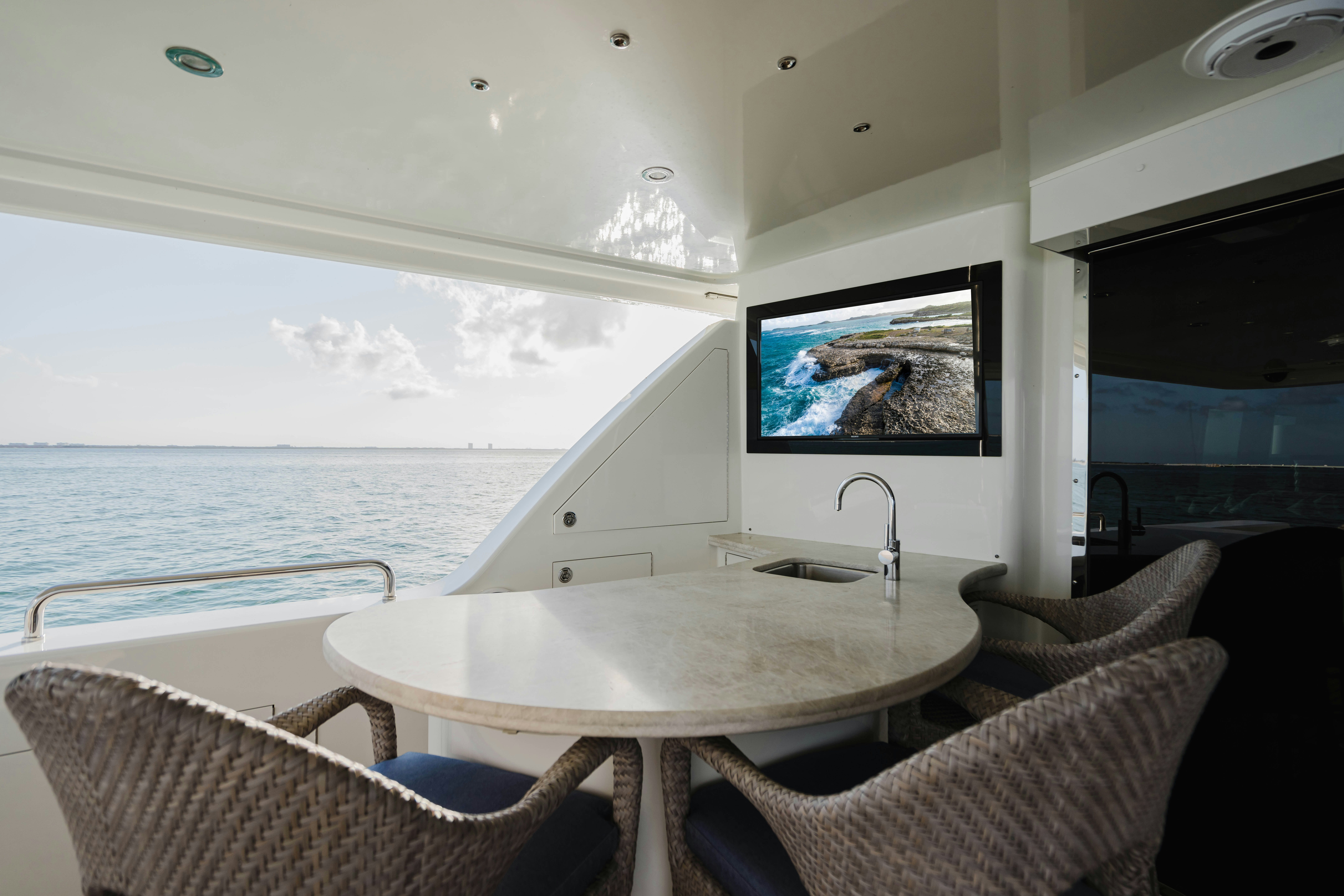 a table and chairs in a room aboard SEAQUINN Yacht for Sale