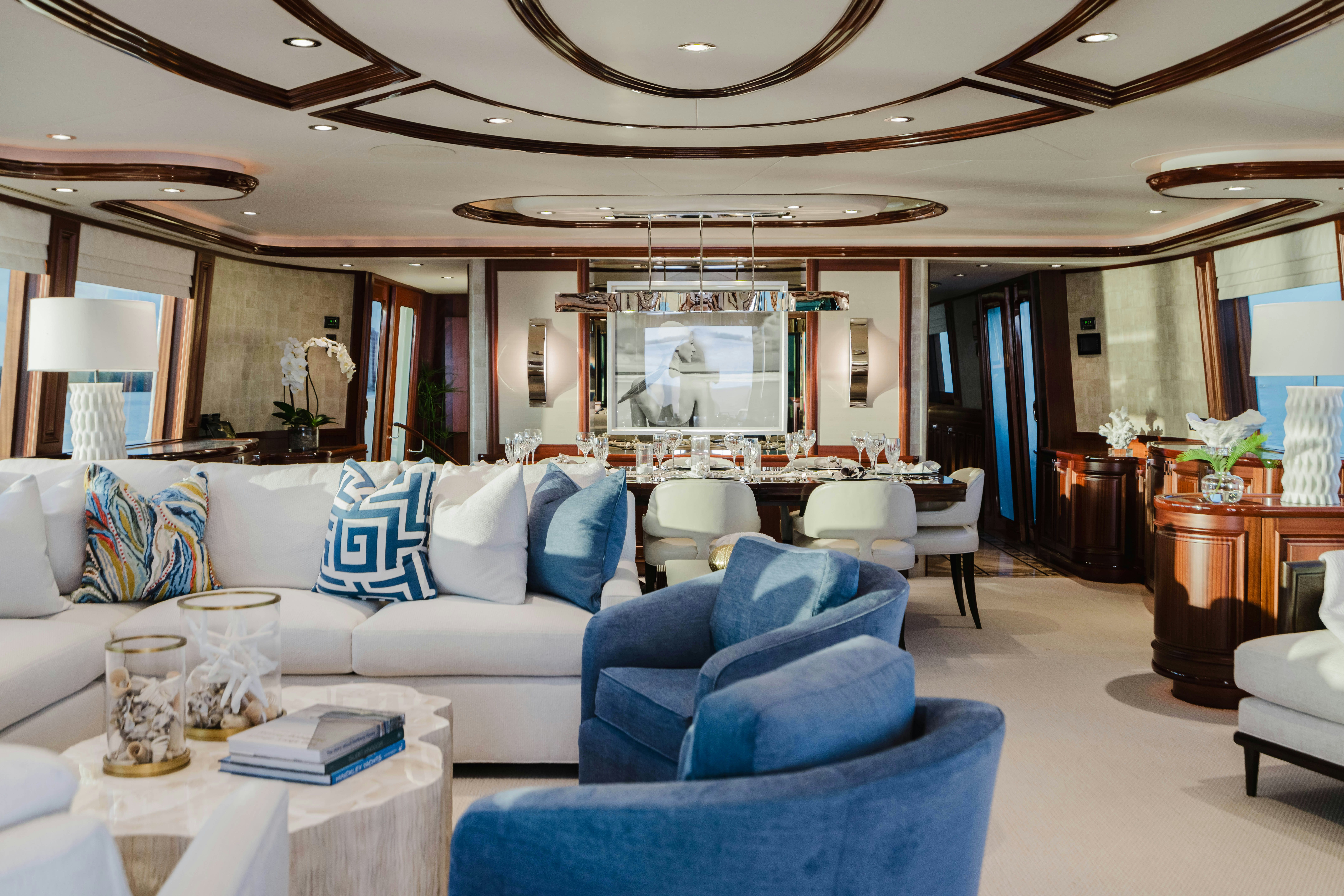a living room with a blue couch aboard SEAQUINN Yacht for Sale