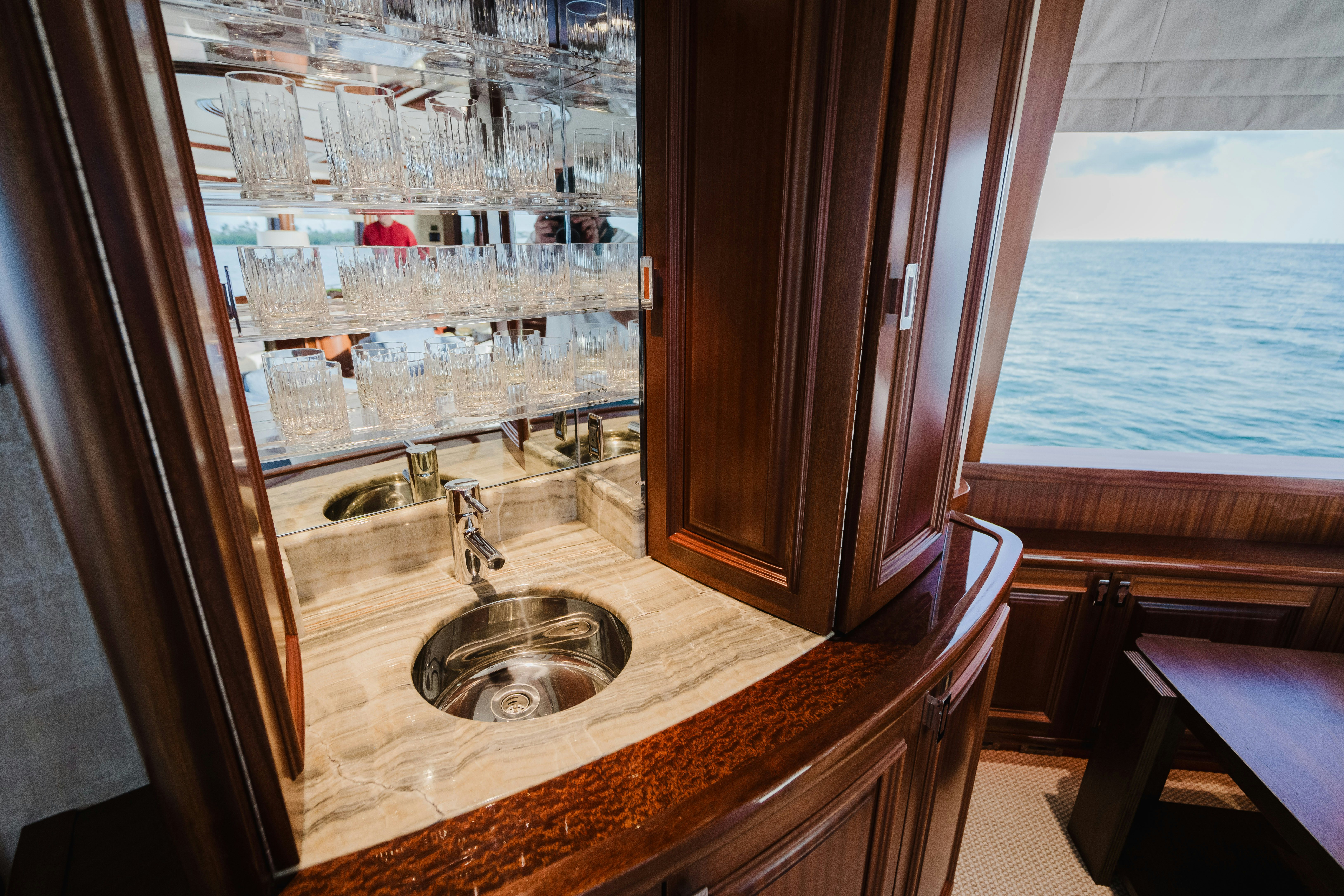 a bathroom with a sink and a window aboard SEAQUINN Yacht for Sale
