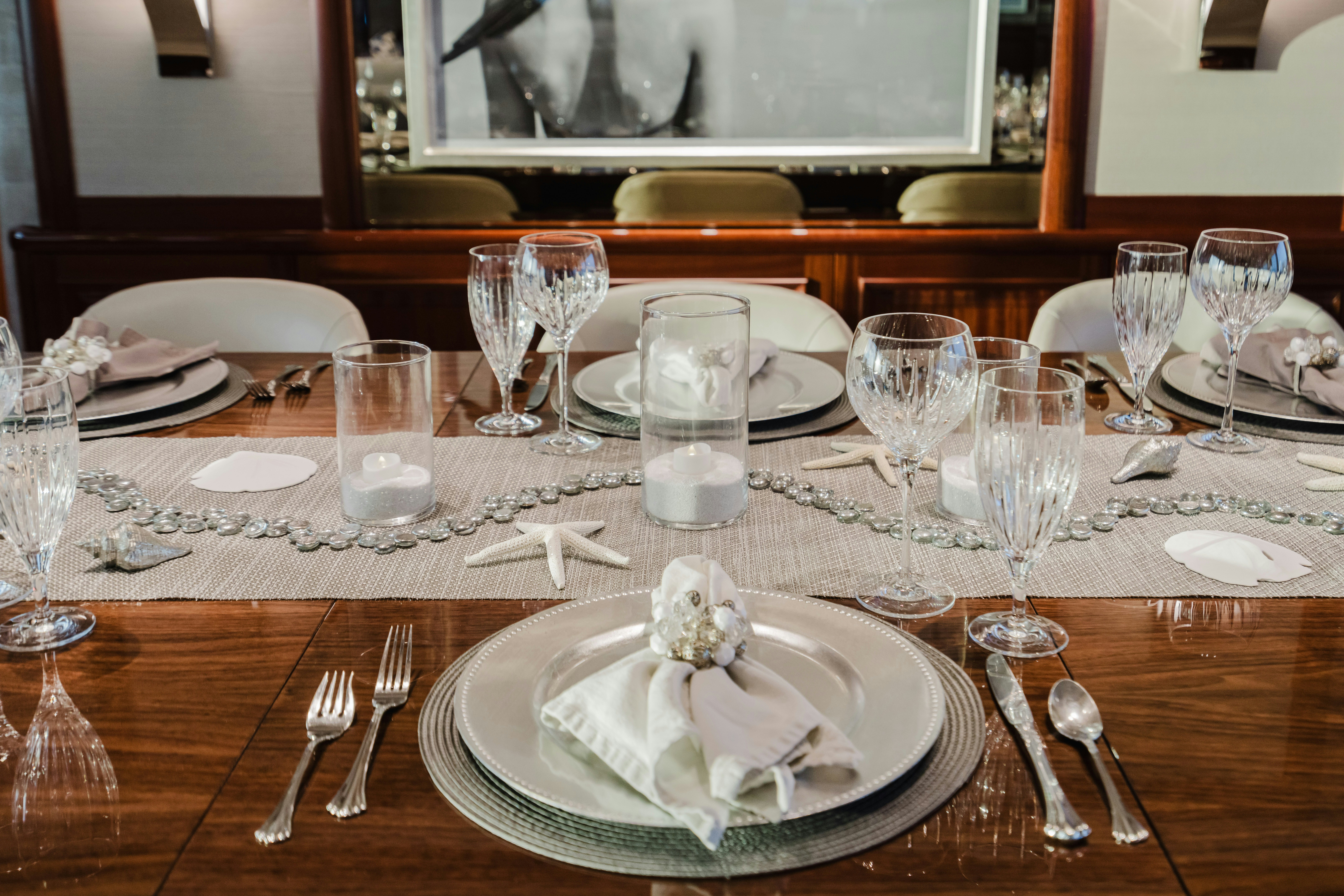 a table with plates and silverware aboard SEAQUINN Yacht for Sale