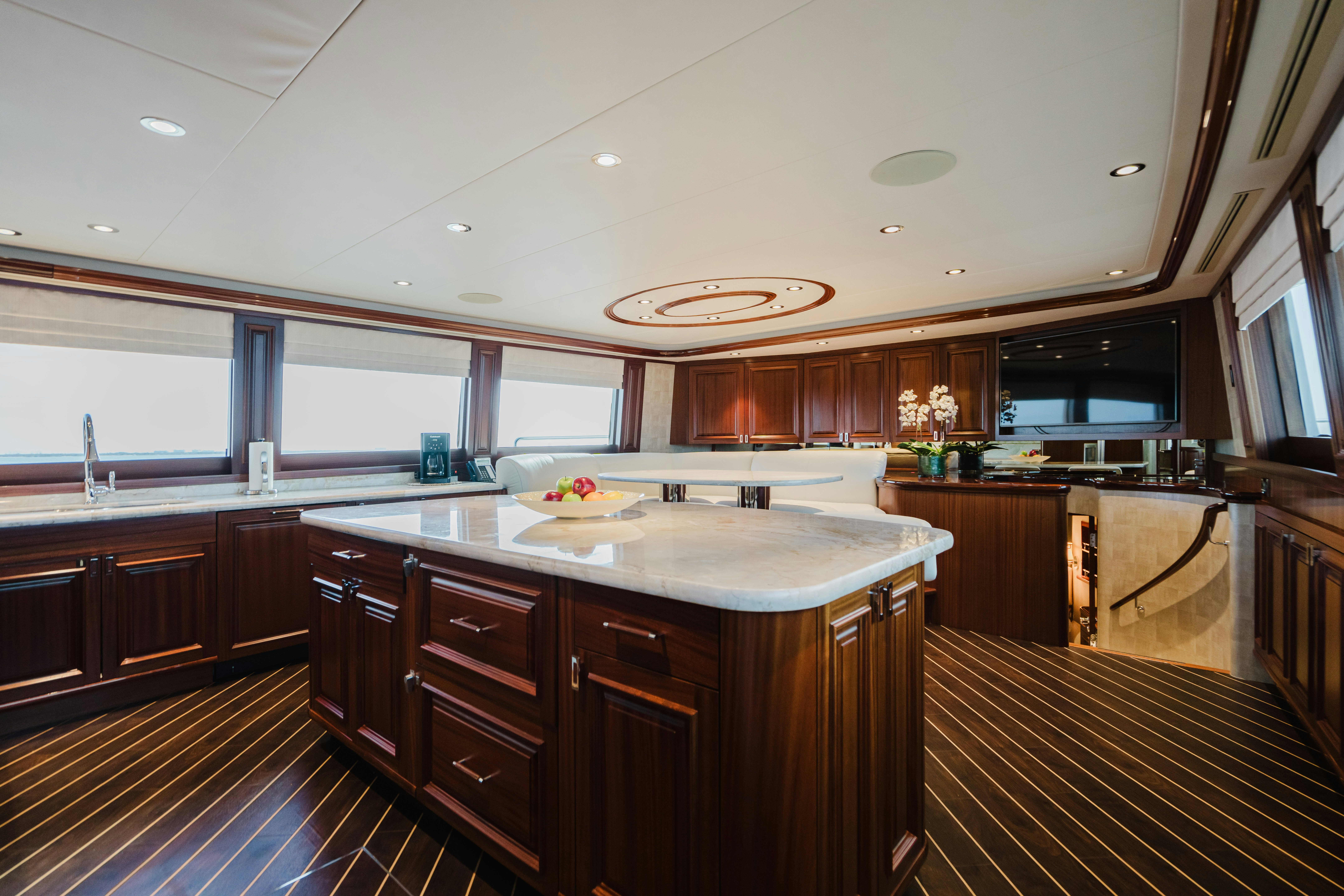 a kitchen with wooden cabinets aboard SEAQUINN Yacht for Sale