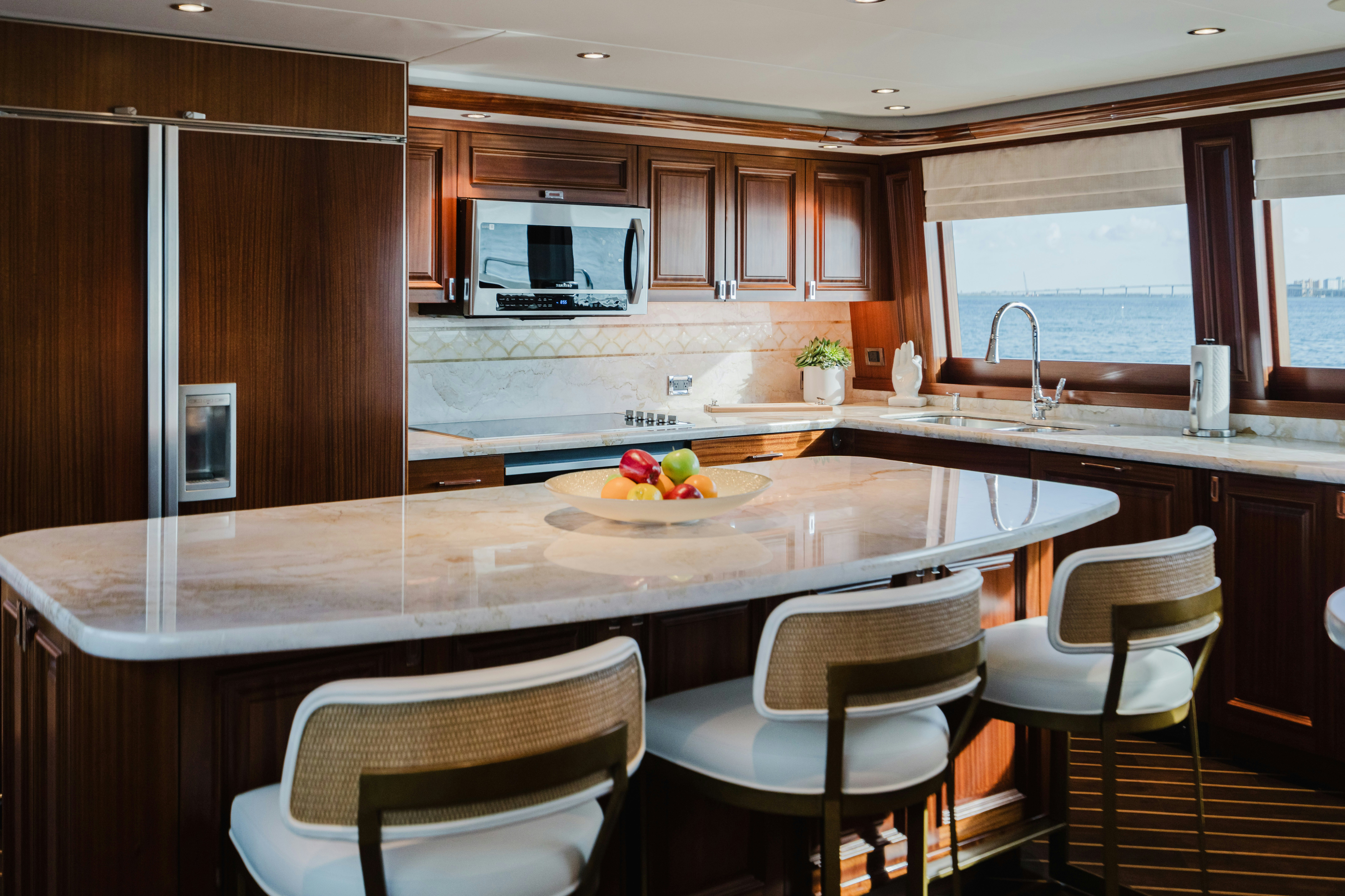 a kitchen with a table and chairs aboard SEAQUINN Yacht for Sale