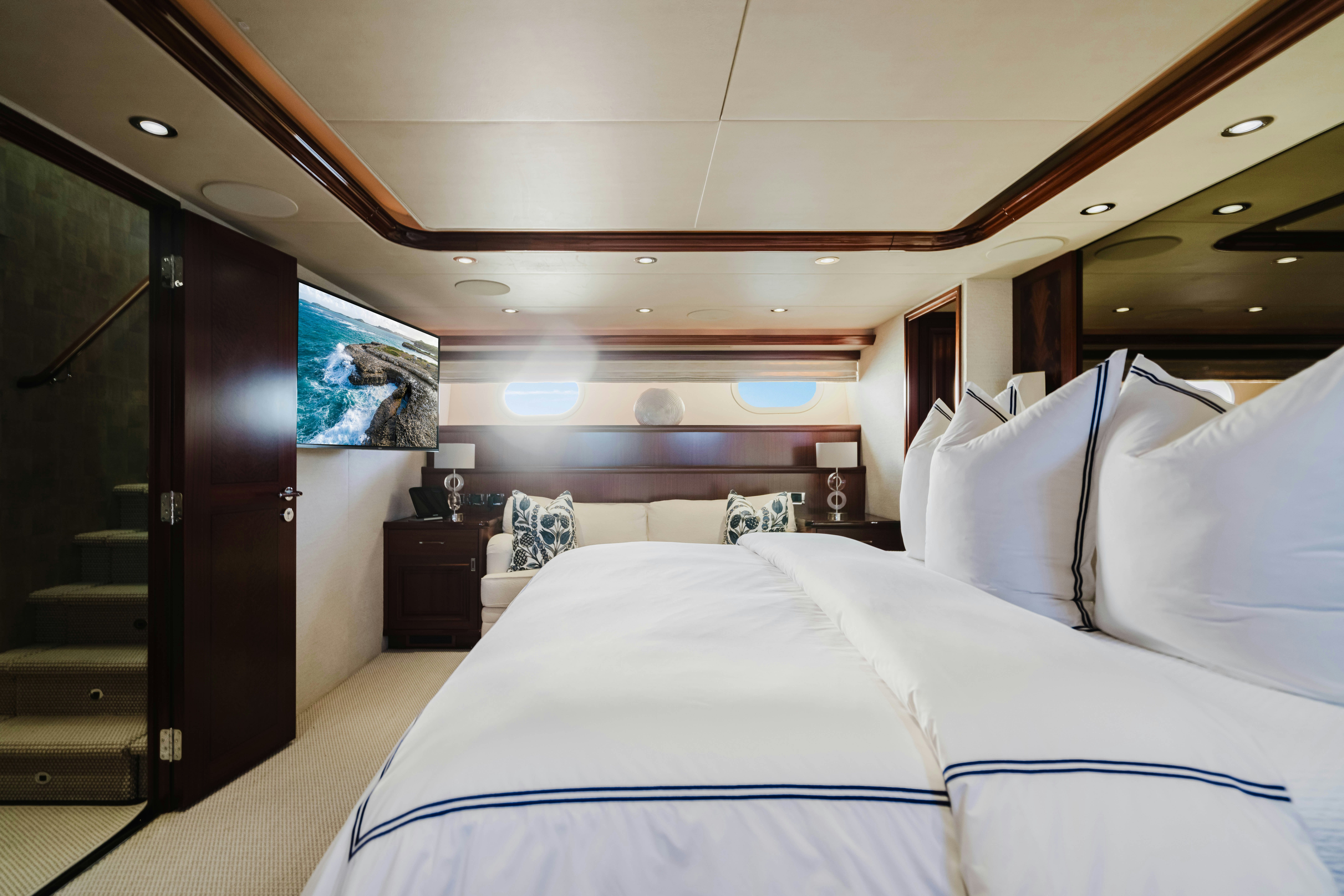 a room with a bed and a desk aboard SEAQUINN Yacht for Sale