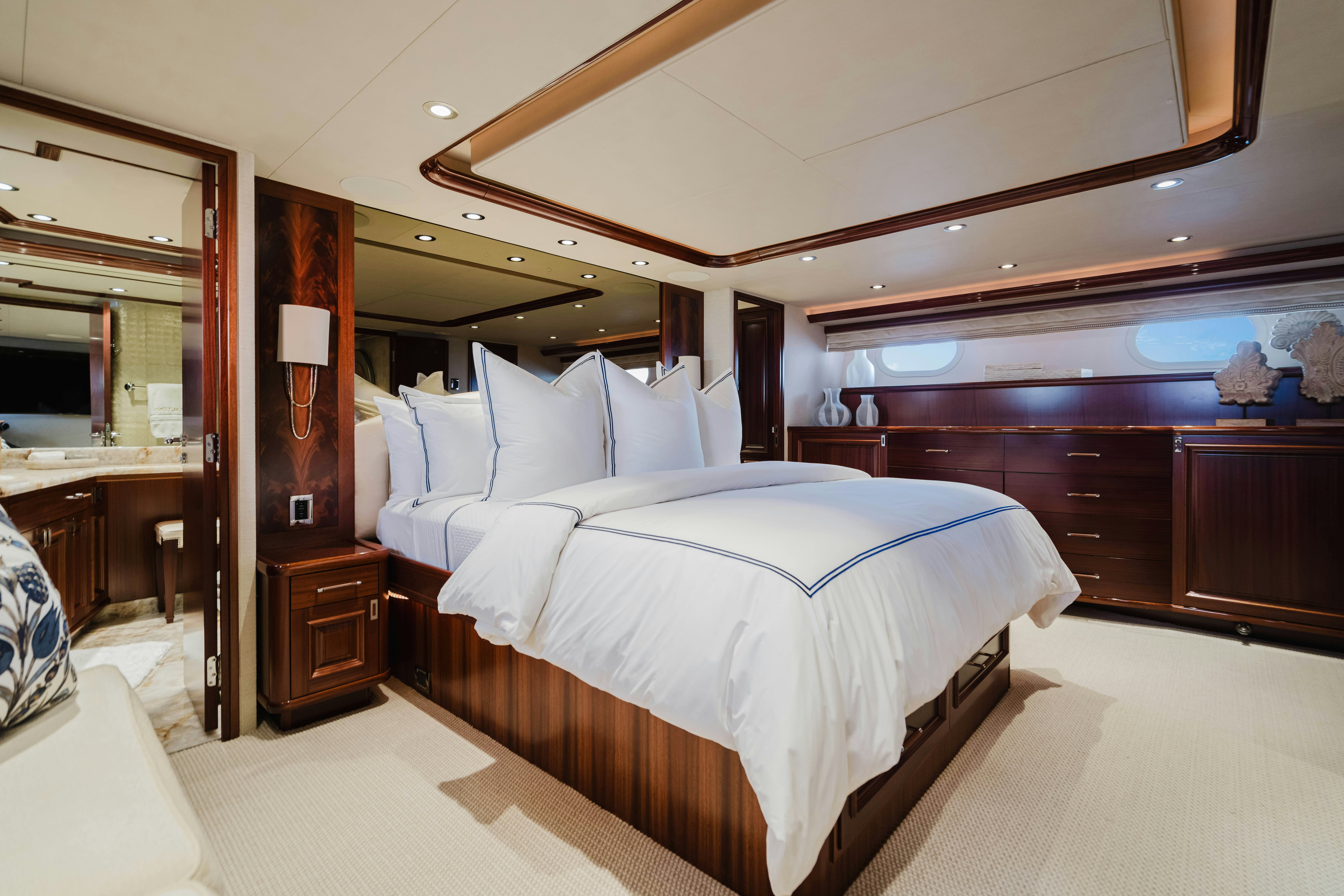 a bedroom with a large bed aboard SEAQUINN Yacht for Sale