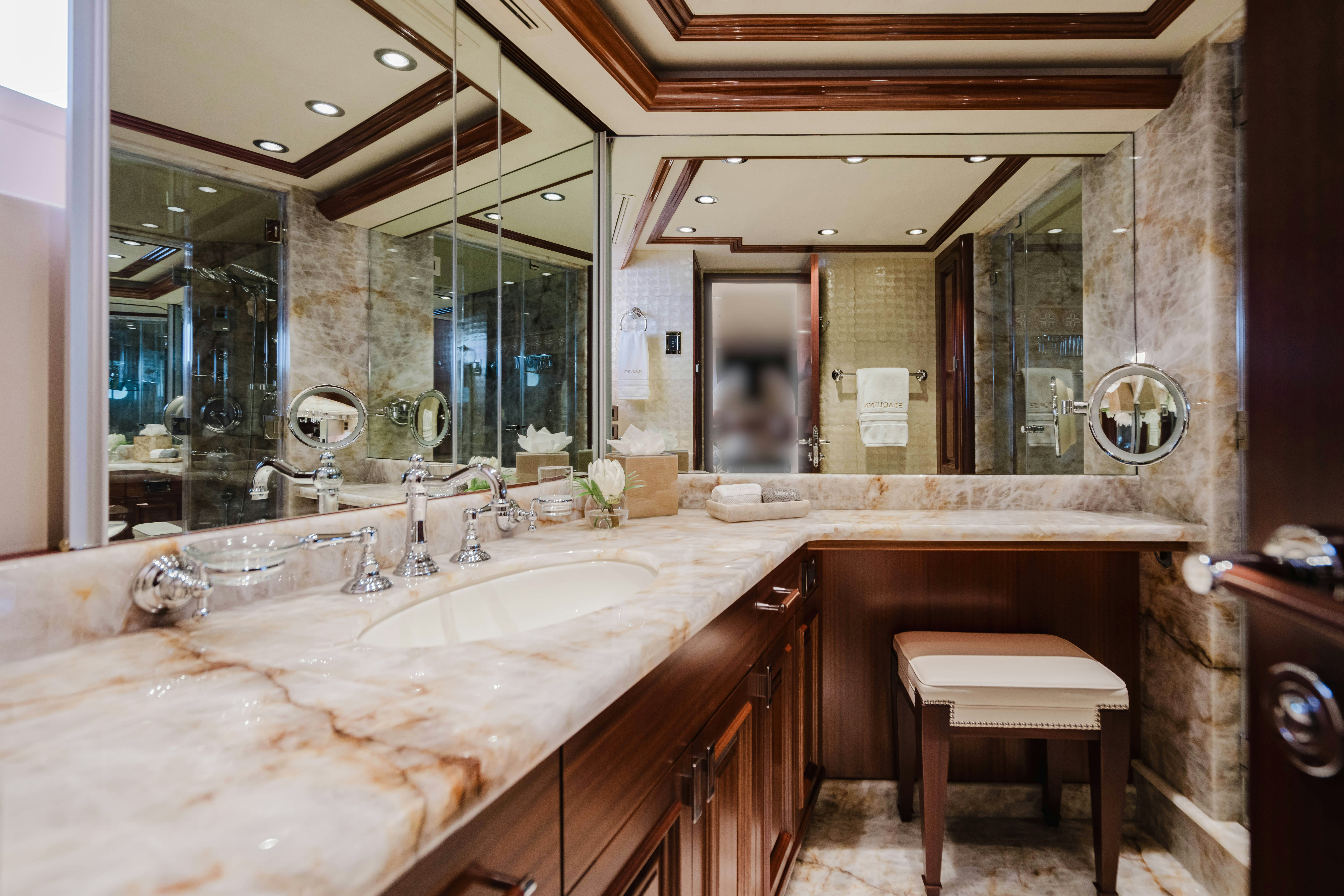 a bathroom with a large mirror aboard SEAQUINN Yacht for Sale