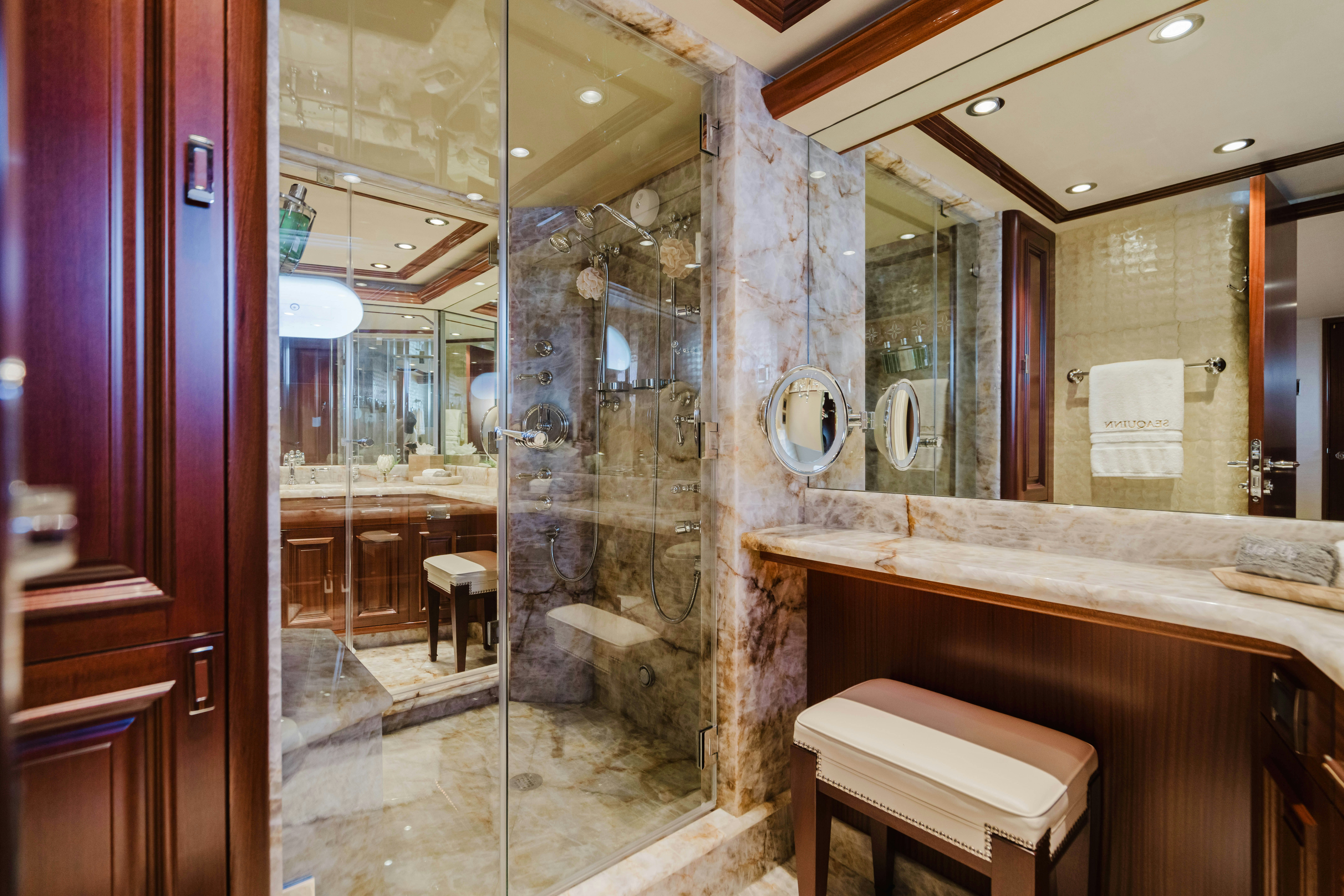 a bathroom with a glass shower aboard SEAQUINN Yacht for Sale