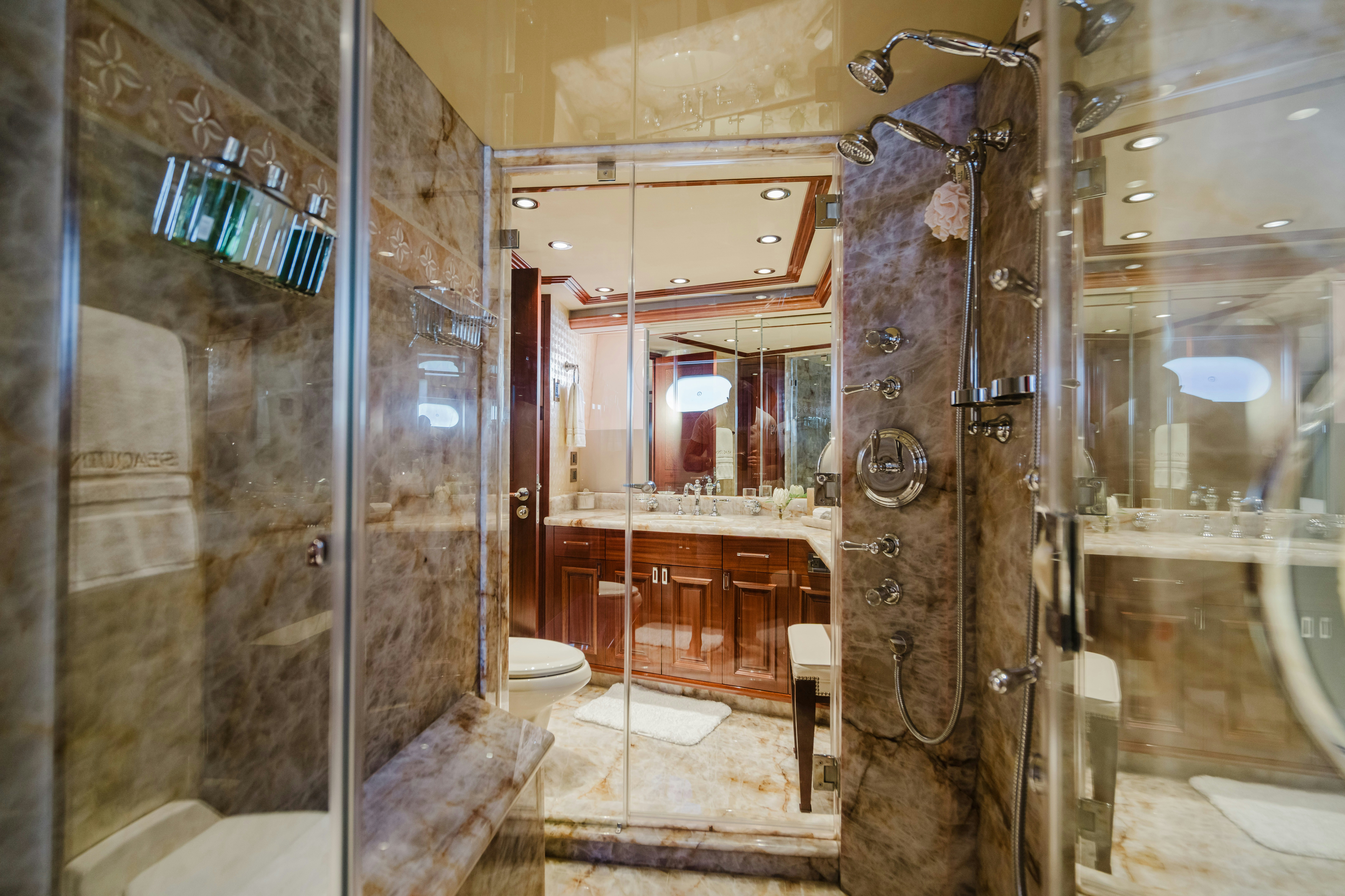 a bathroom with a glass shower aboard SEAQUINN Yacht for Sale