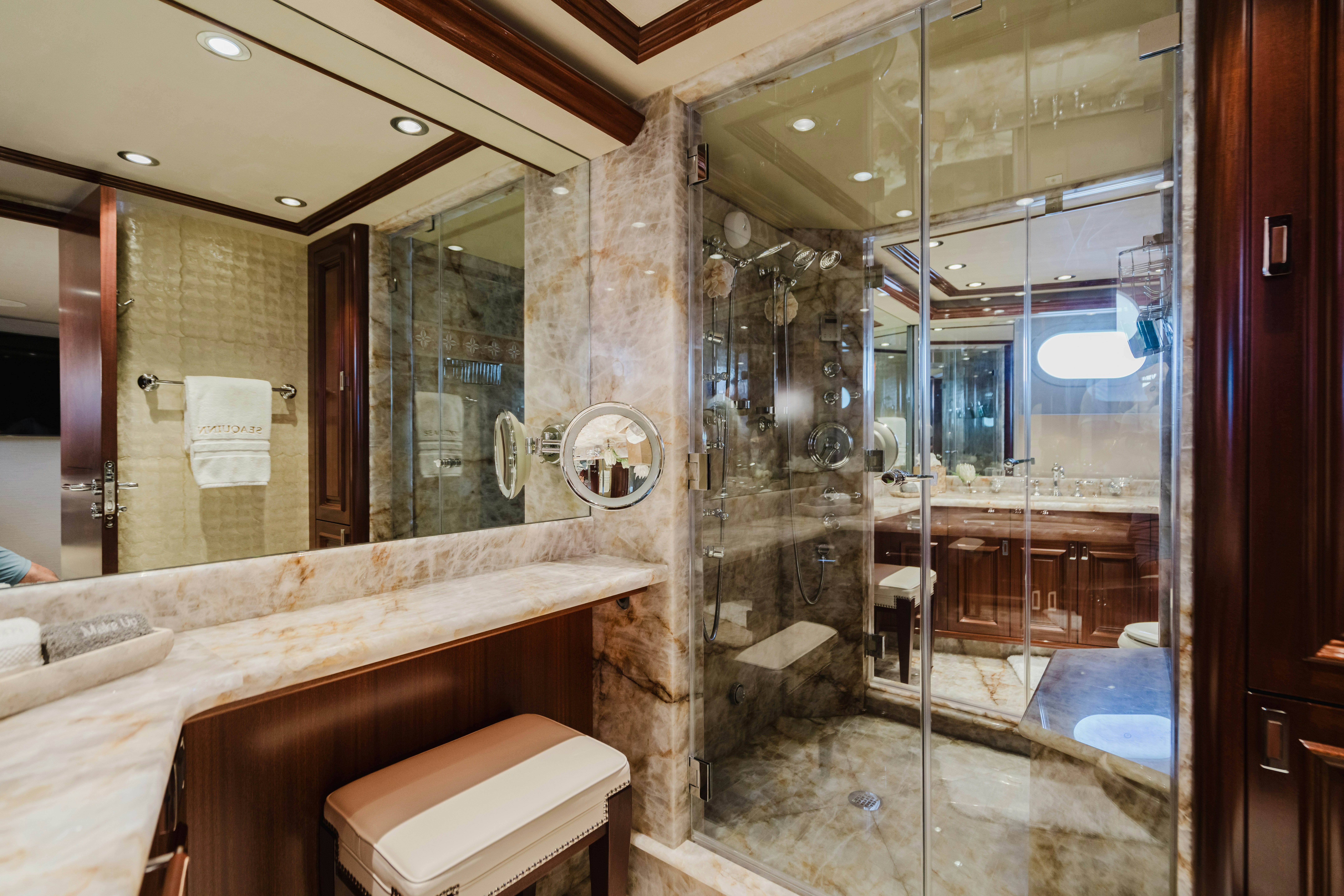 a bathroom with a glass shower aboard SEAQUINN Yacht for Sale
