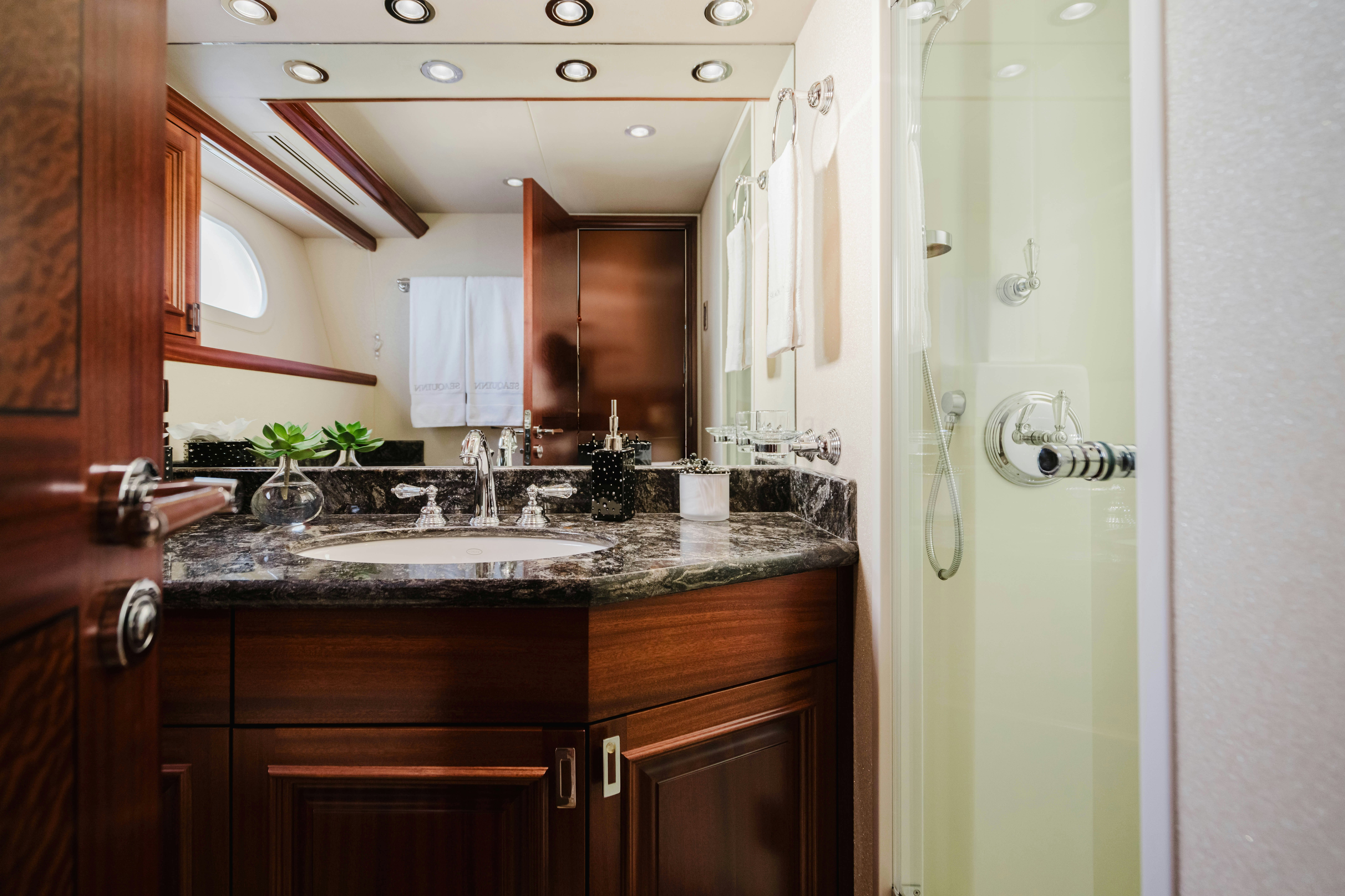 a bathroom with a sink and a mirror aboard SEAQUINN Yacht for Sale