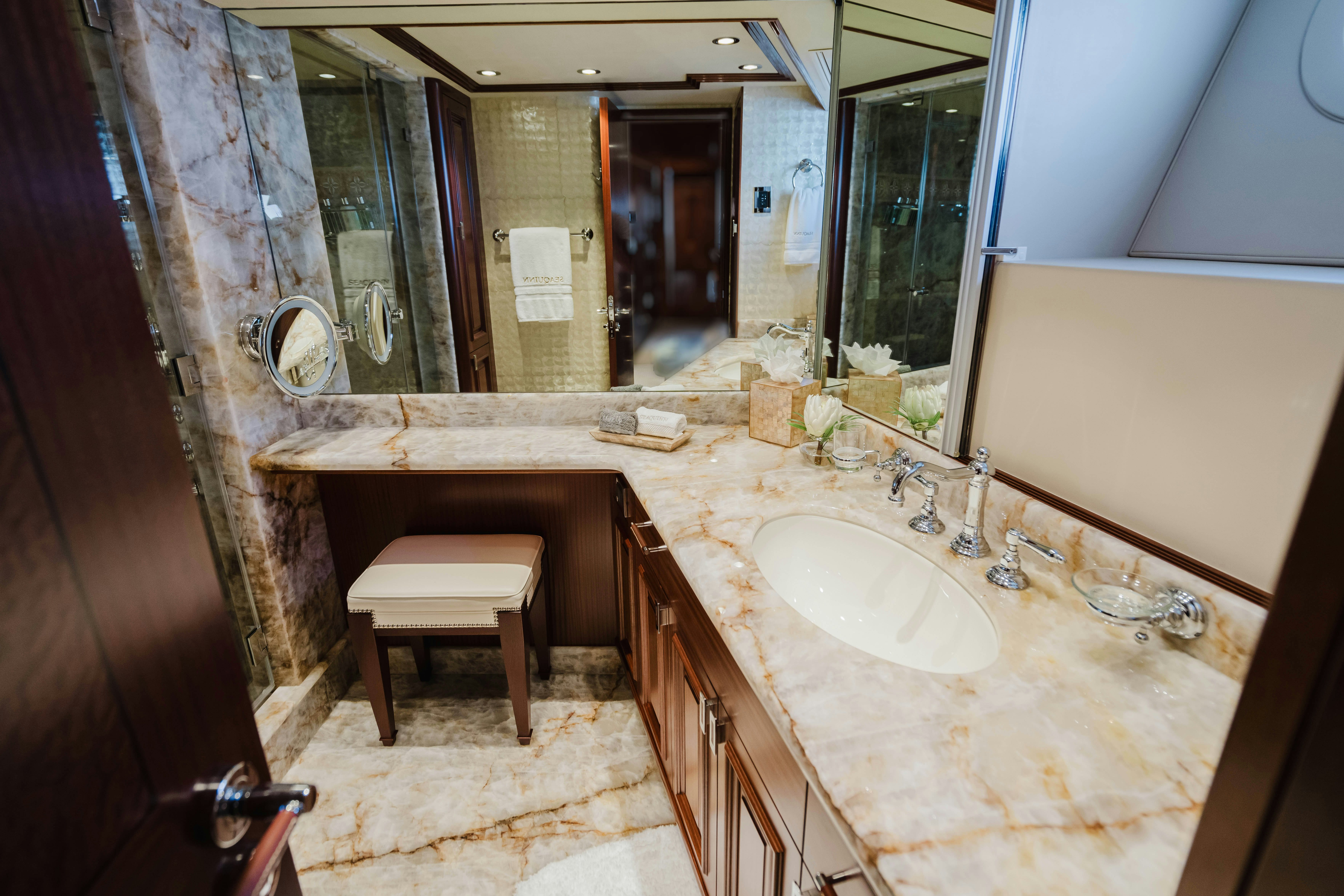 a bathroom with a countertop sink and mirror aboard SEAQUINN Yacht for Sale