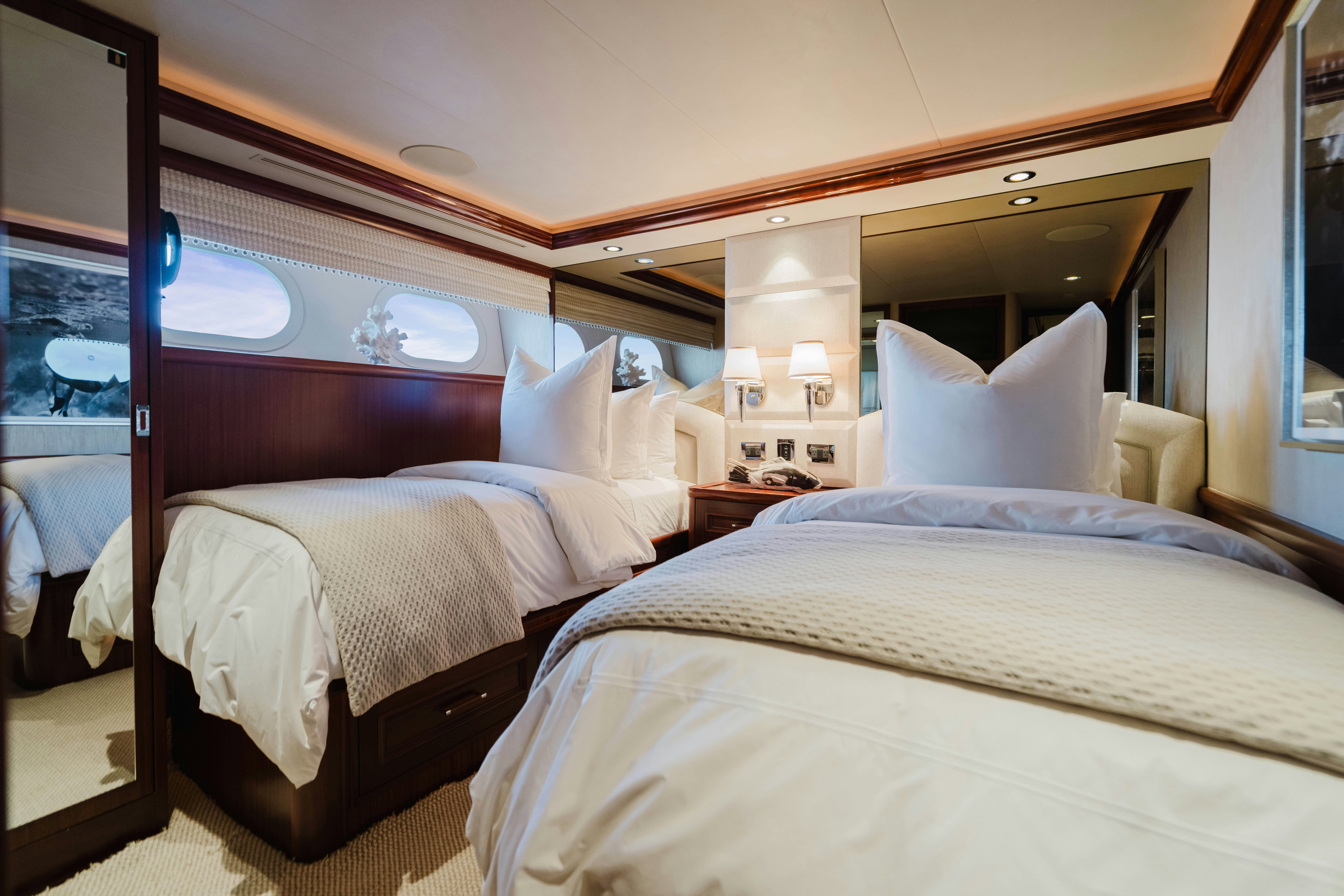 a couple of beds in a hotel room aboard SEAQUINN Yacht for Sale