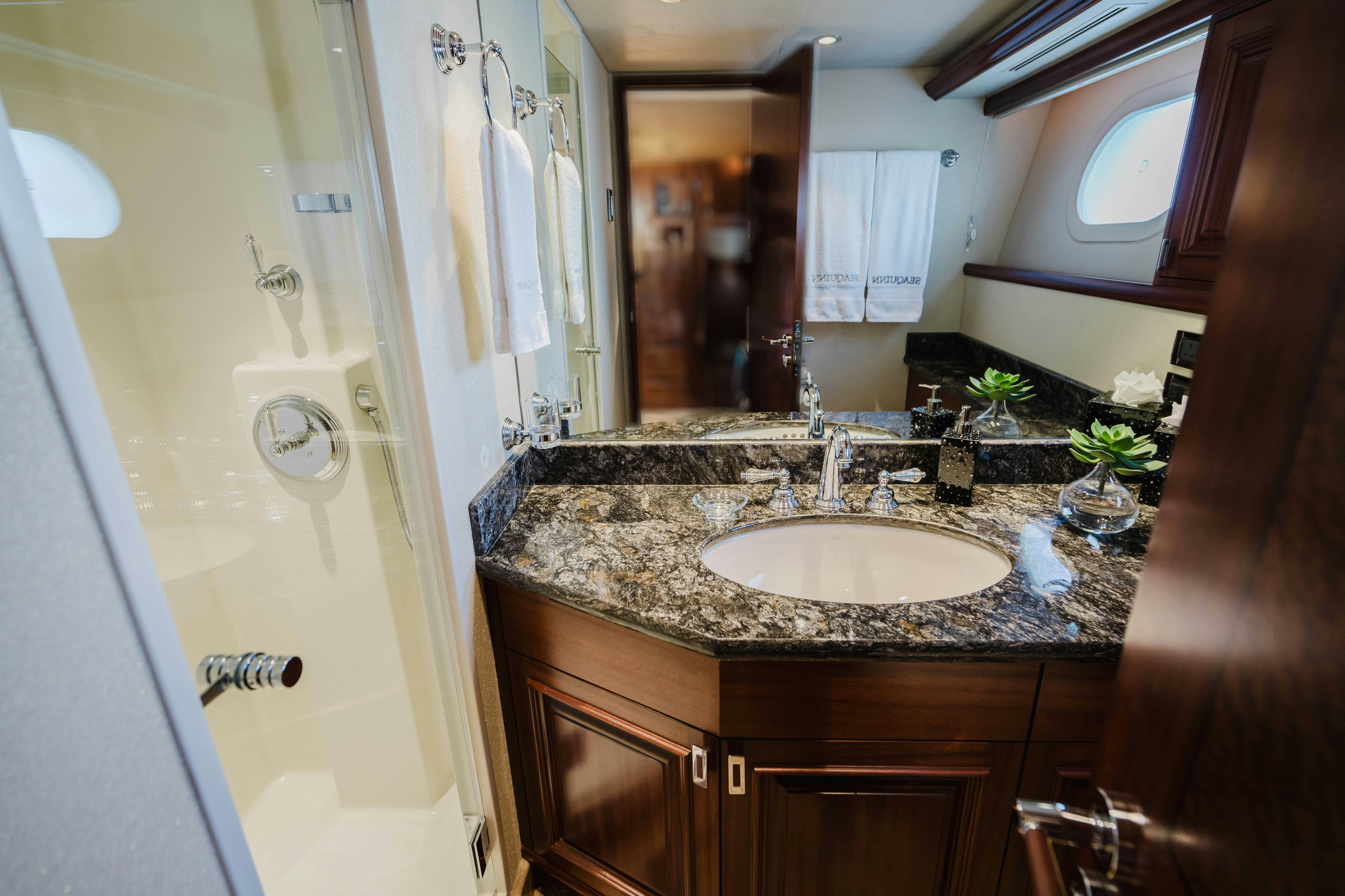 a bathroom with a sink and a mirror aboard SEAQUINN Yacht for Sale