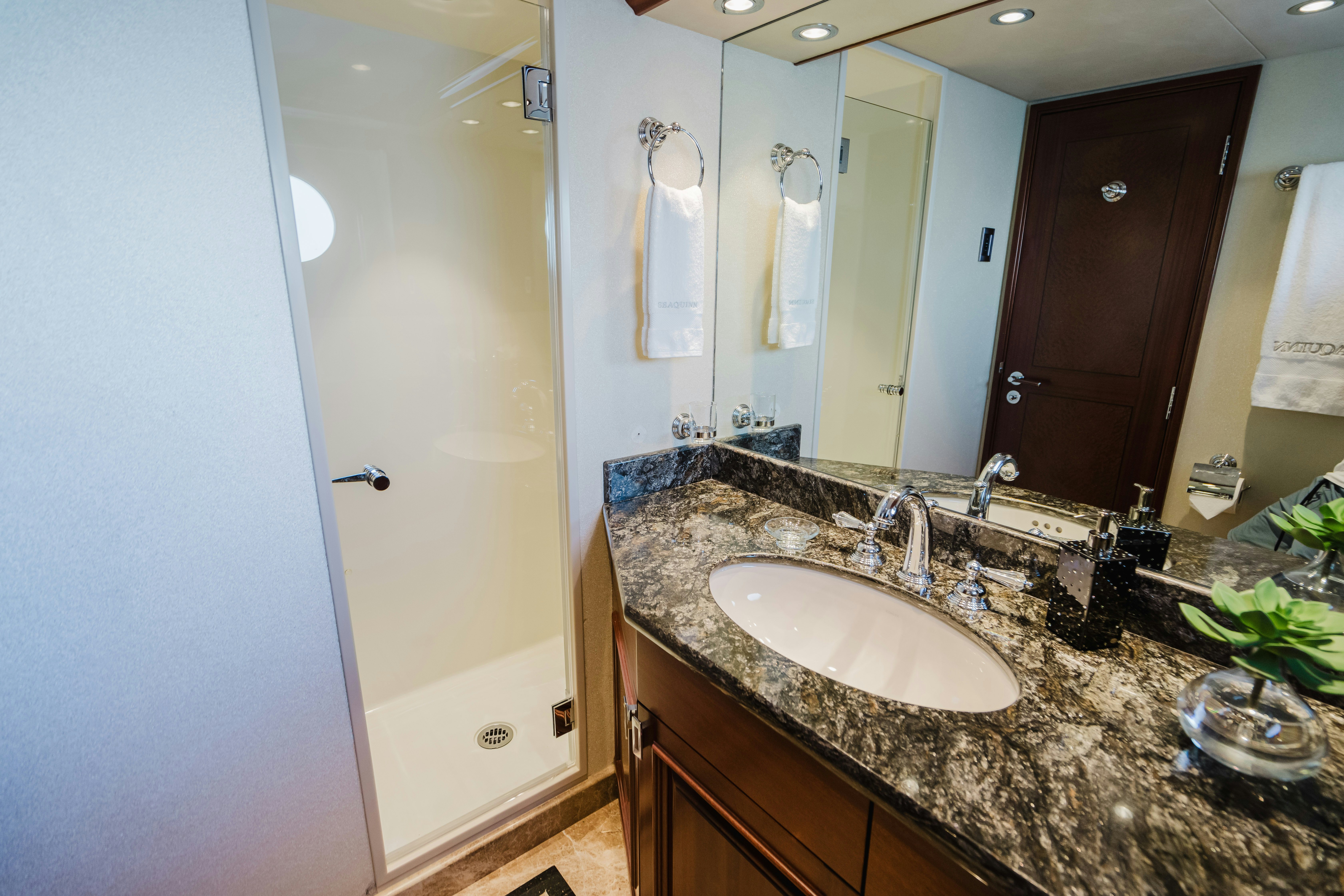 a bathroom with a countertop sink and mirror aboard SEAQUINN Yacht for Sale