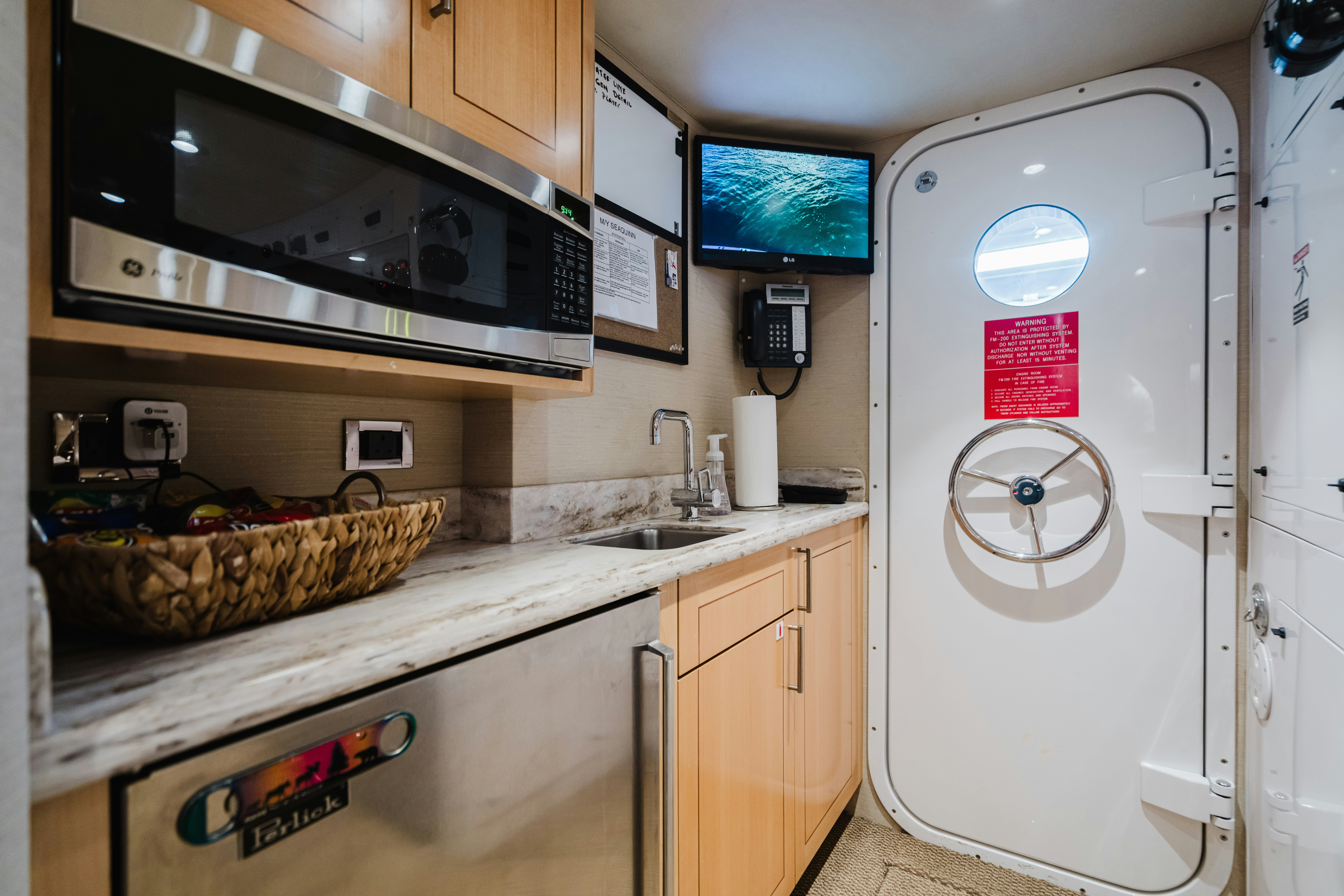 a kitchen with a microwave oven and a microwave aboard SEAQUINN Yacht for Sale