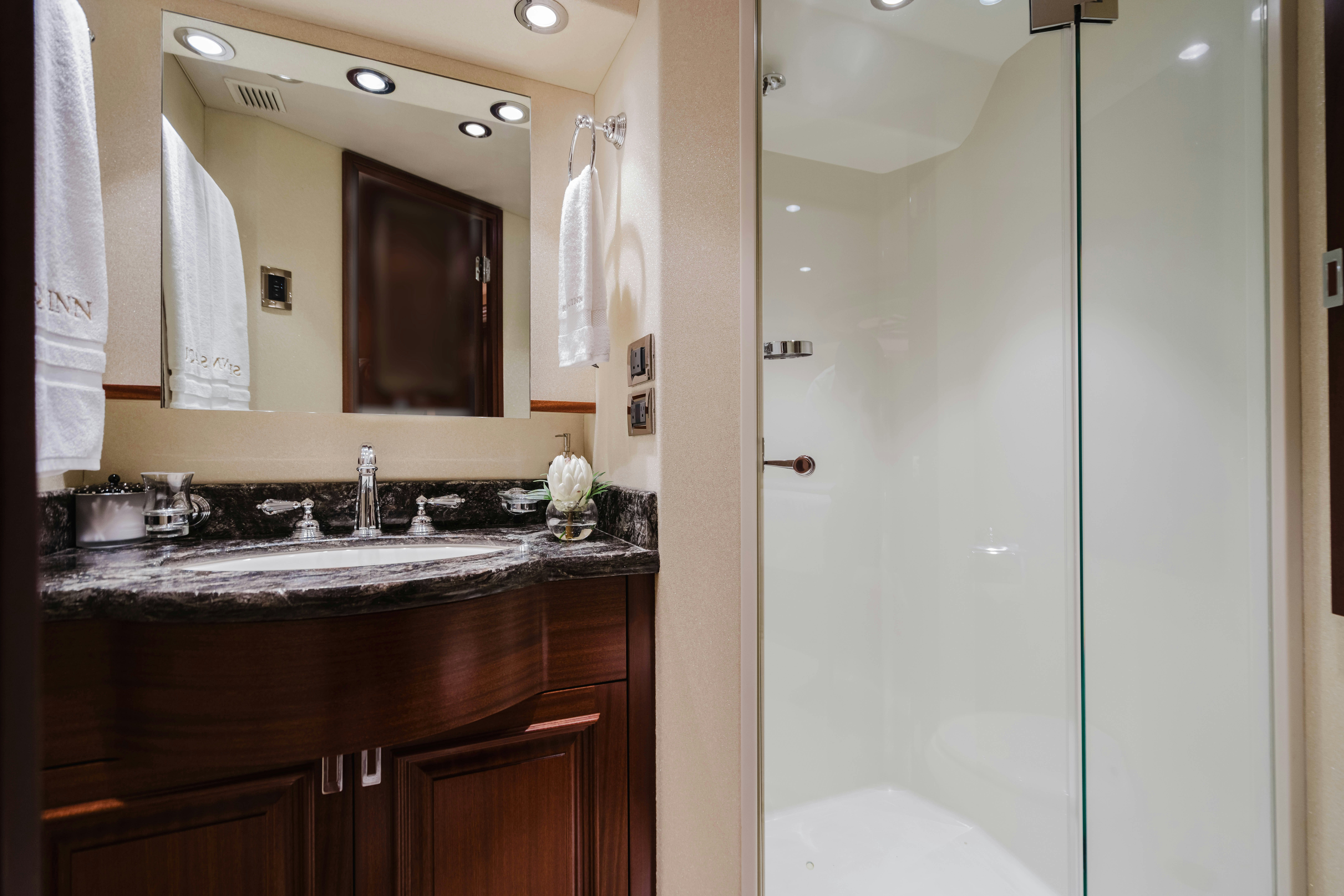 a bathroom with a large mirror aboard SEAQUINN Yacht for Sale