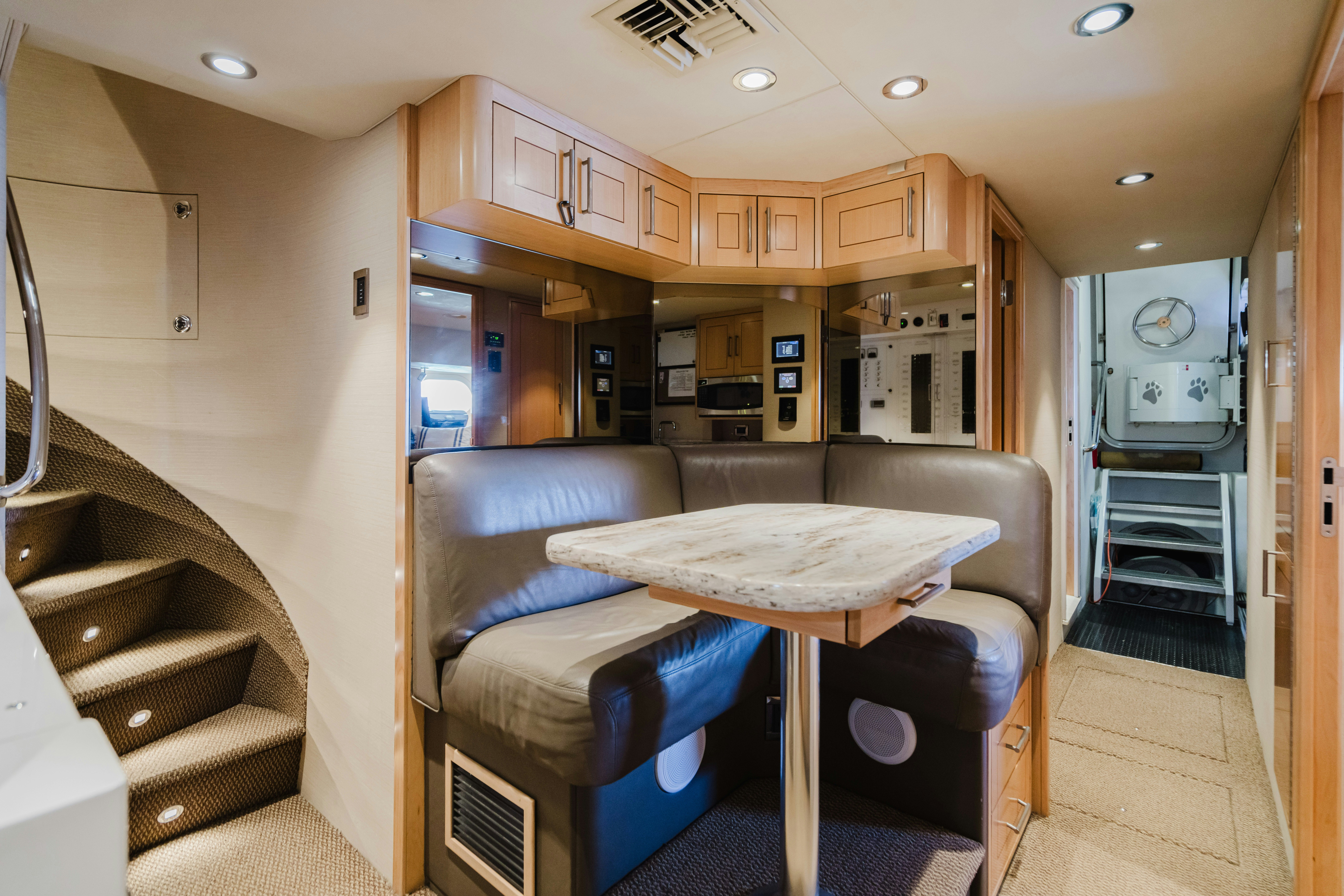 a kitchen with a table and chairs aboard SEAQUINN Yacht for Sale