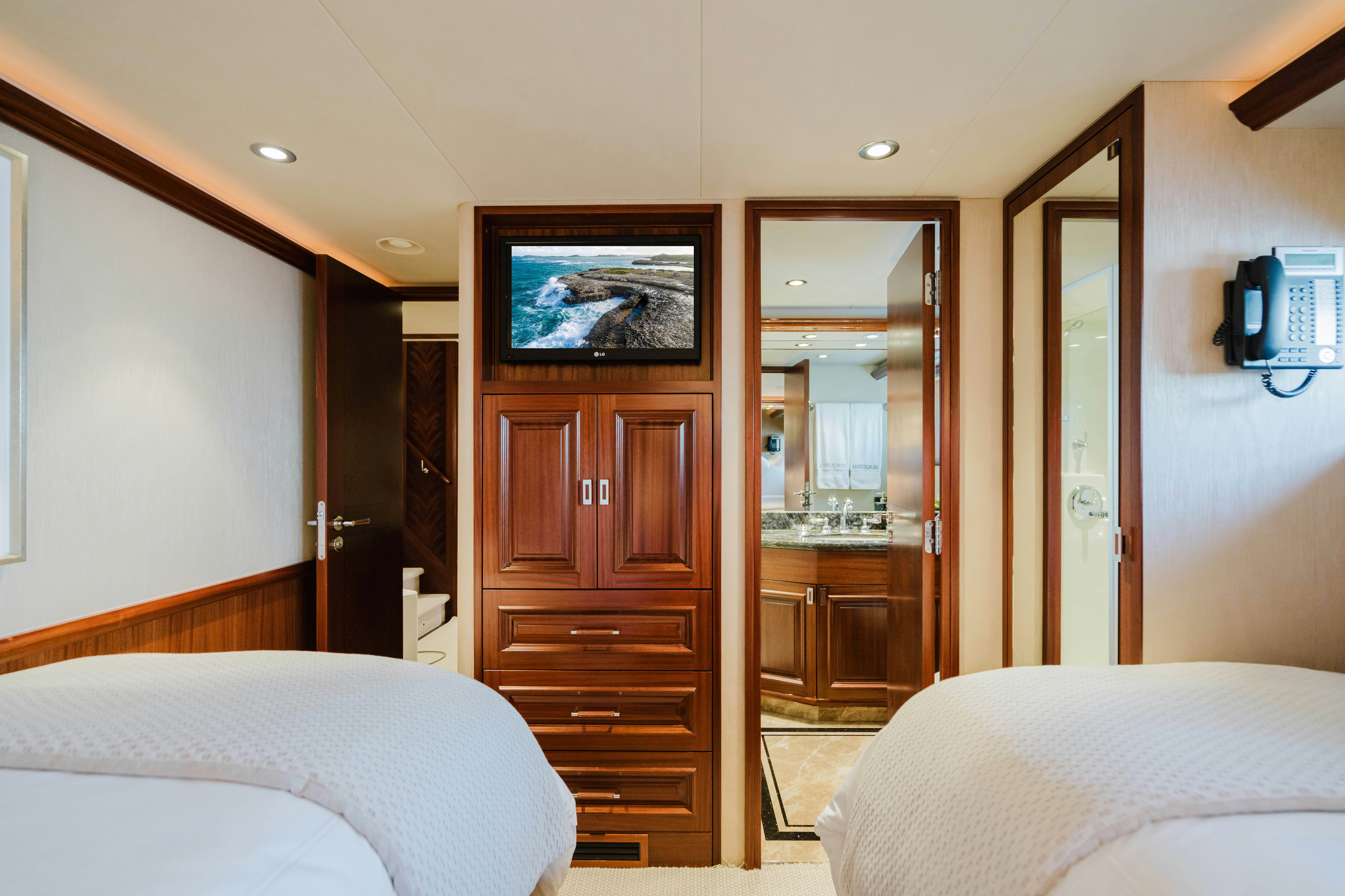 a bedroom with a closet and a bed aboard SEAQUINN Yacht for Sale