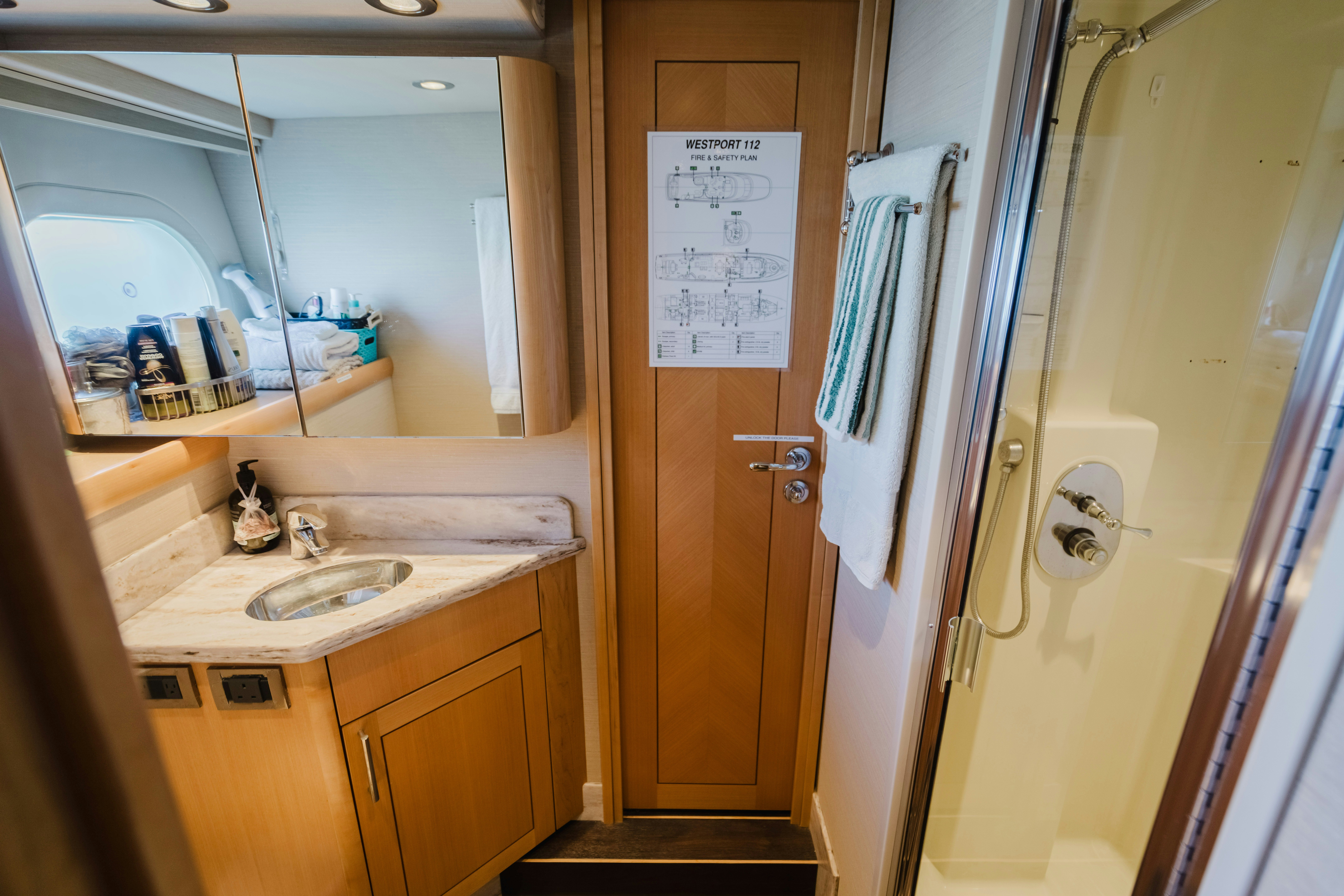 a bathroom with a sink and a mirror aboard SEAQUINN Yacht for Sale